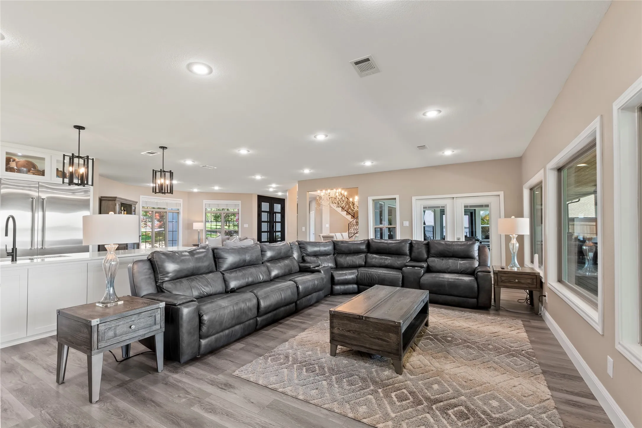 Open concept living space perfect for entertaining large groups with two living areas and two dining spaces.