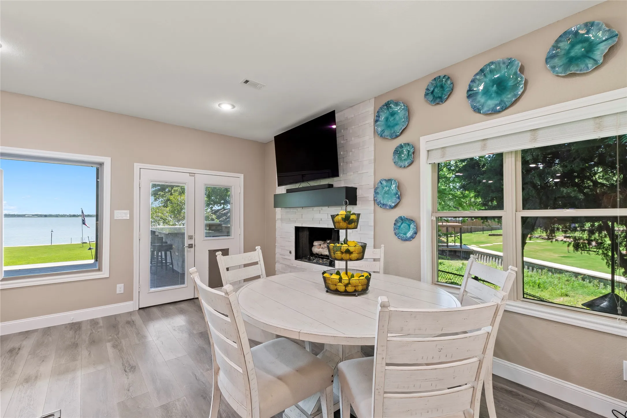 Dining space located just off the kitchen between the main living area gas log fireplace.