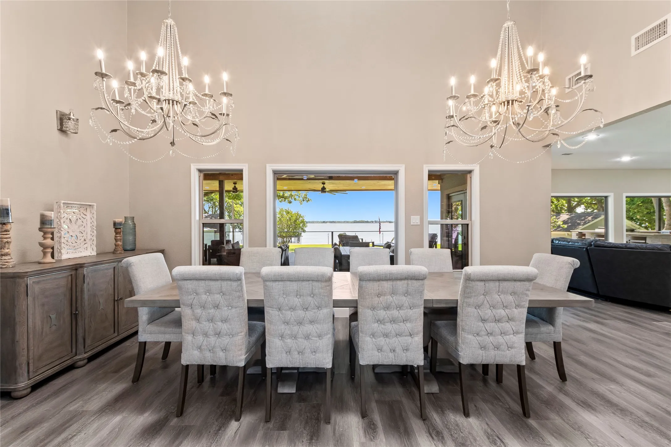 Formal dining space with large picture windows showcasing the open water views!