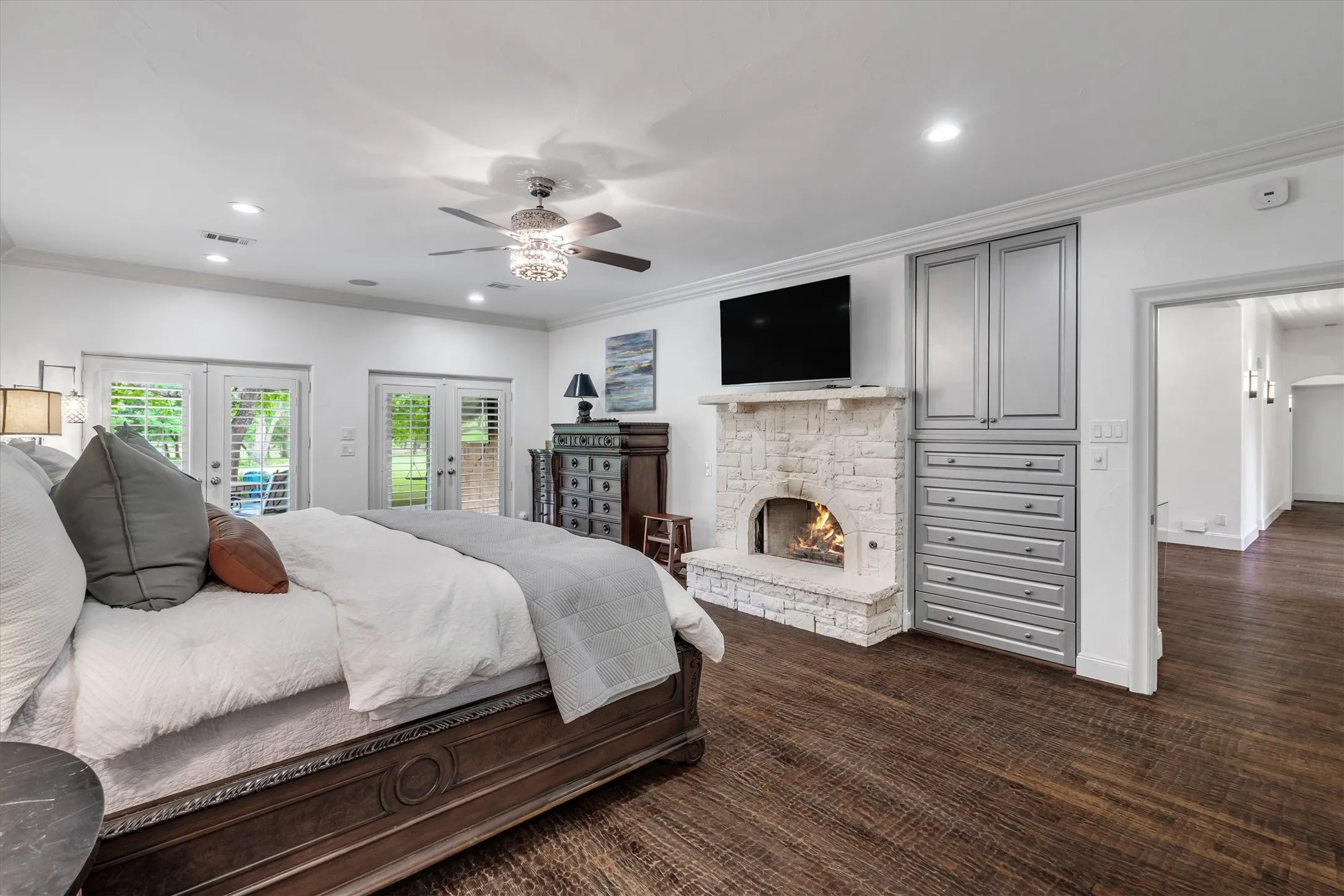 Primary bedroom with cozy fireplace.