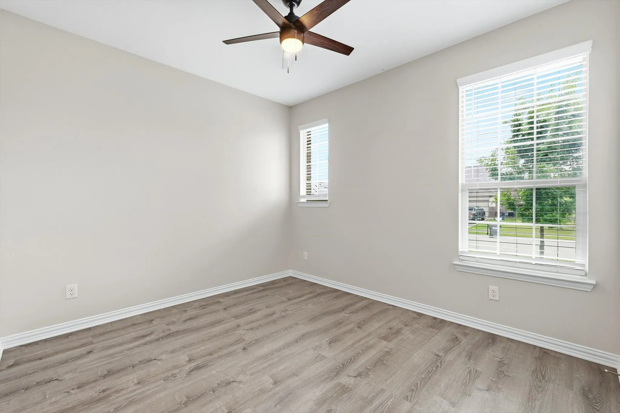 Front bedroom with LVP flooring would make a great home office or flex space.