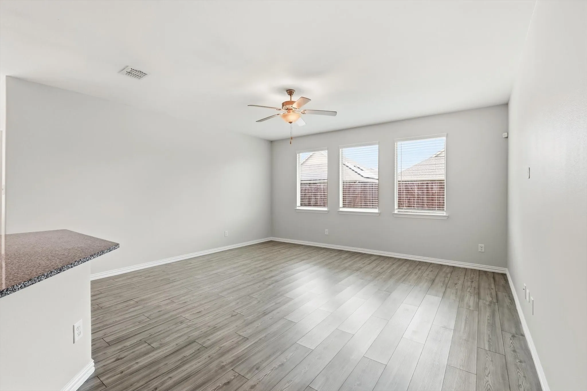 Living room has lots of natural light and views of your beautiful backyard.
