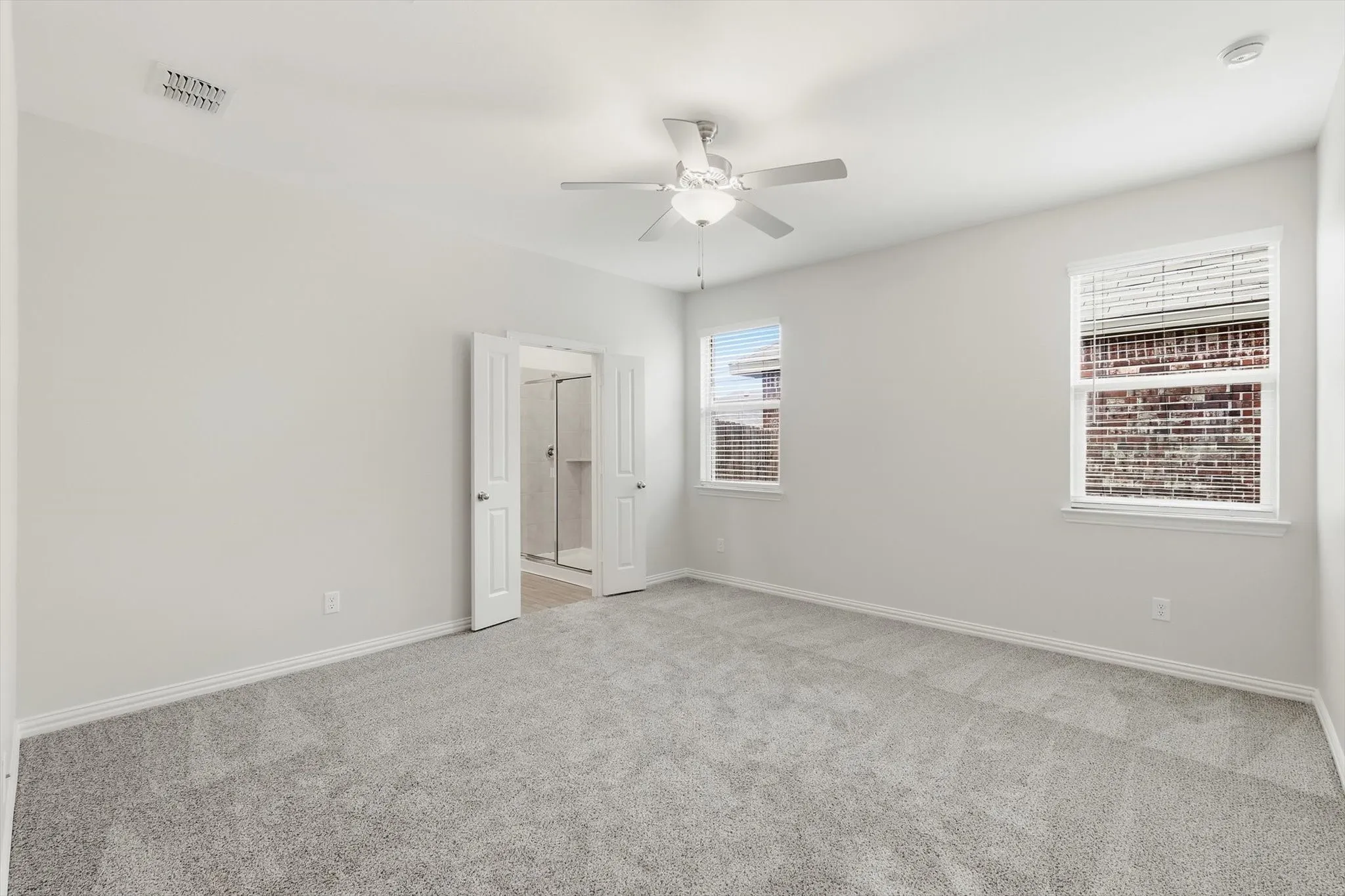 Spacious Primary retreat with ensuite bath. Fresh paint and carpet.