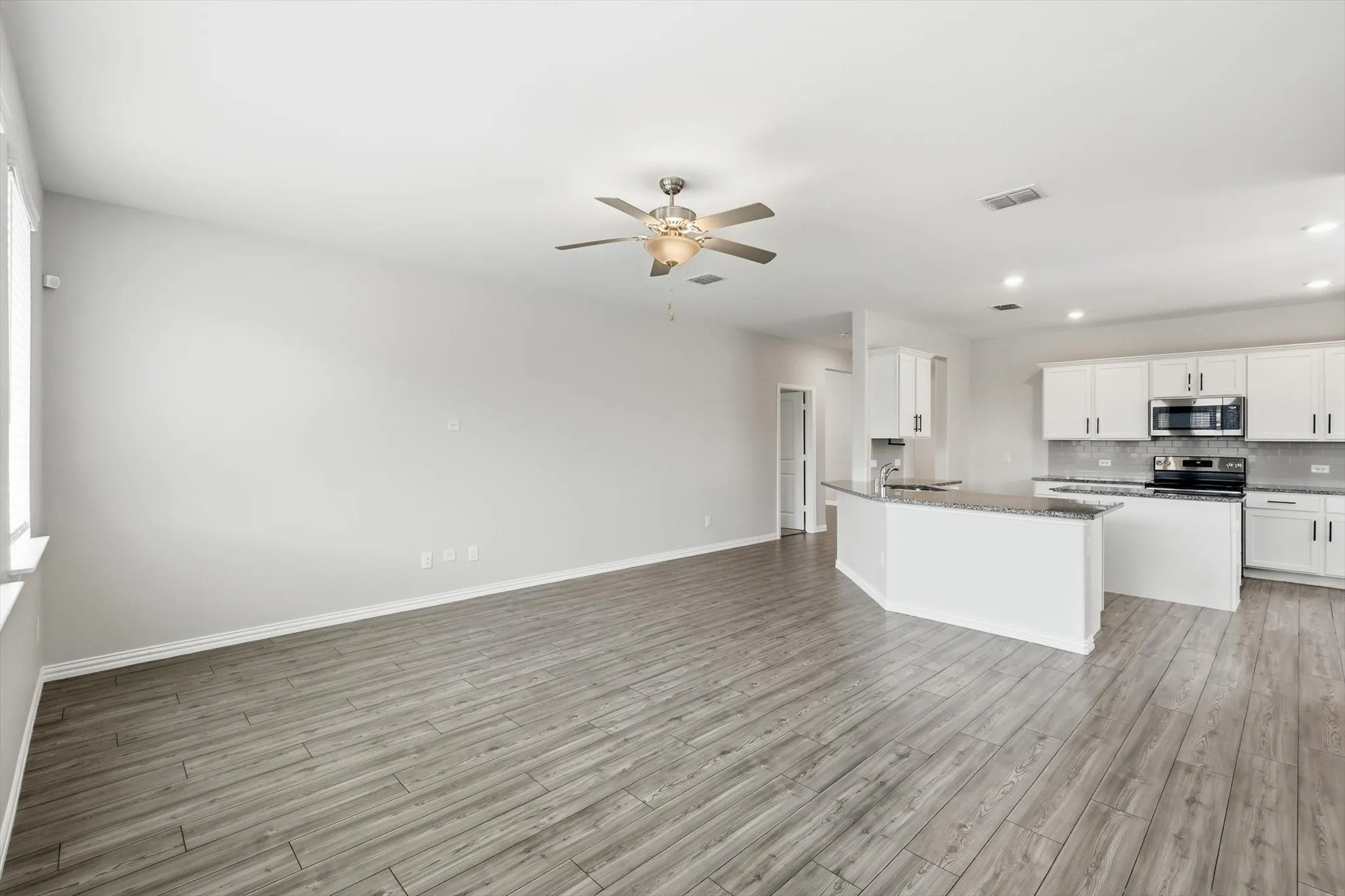 Living Room features LVP and open floor plan - perfect for entertaining