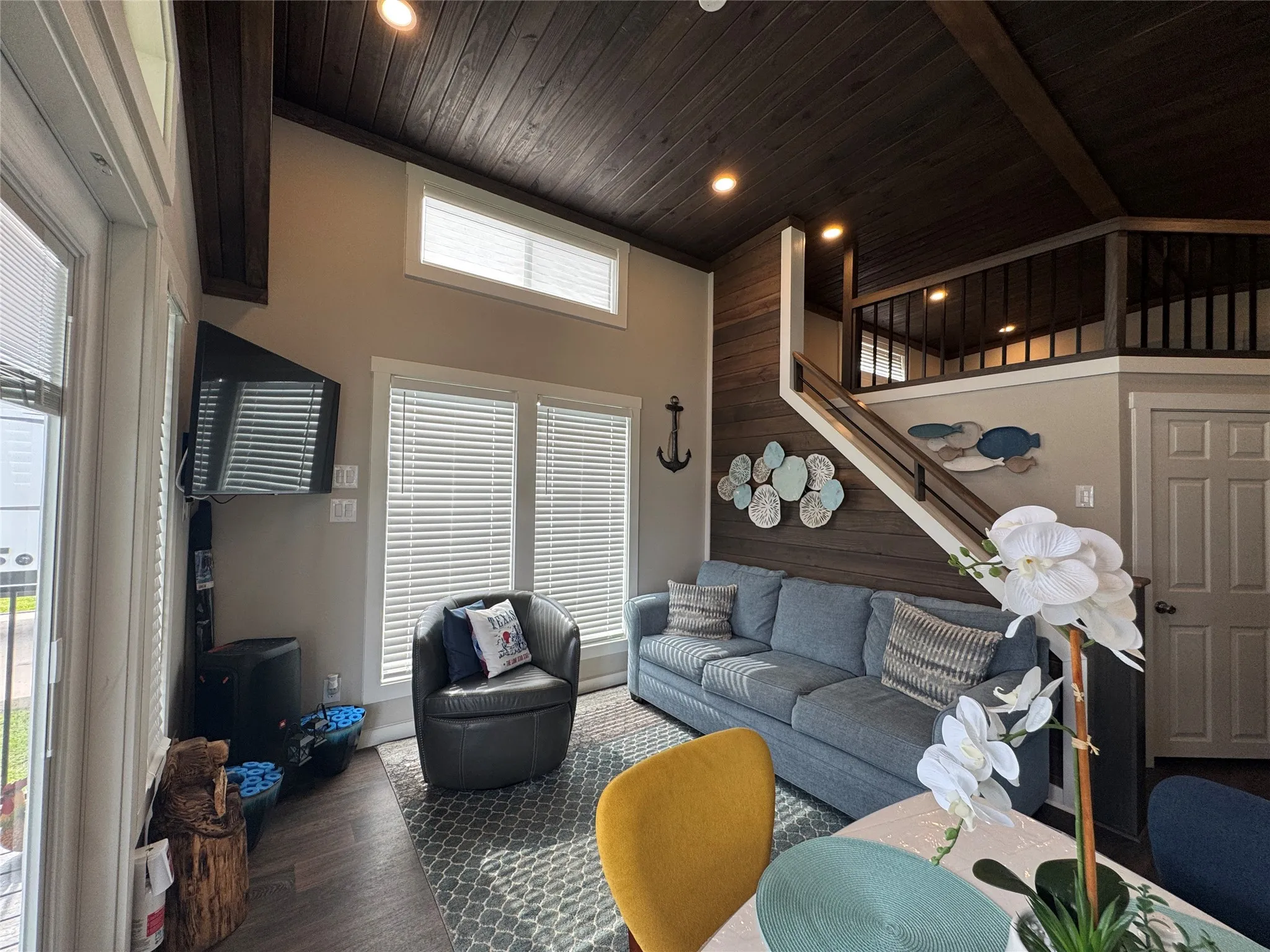 Vaulted ceiling with wood paneling and exposed beams