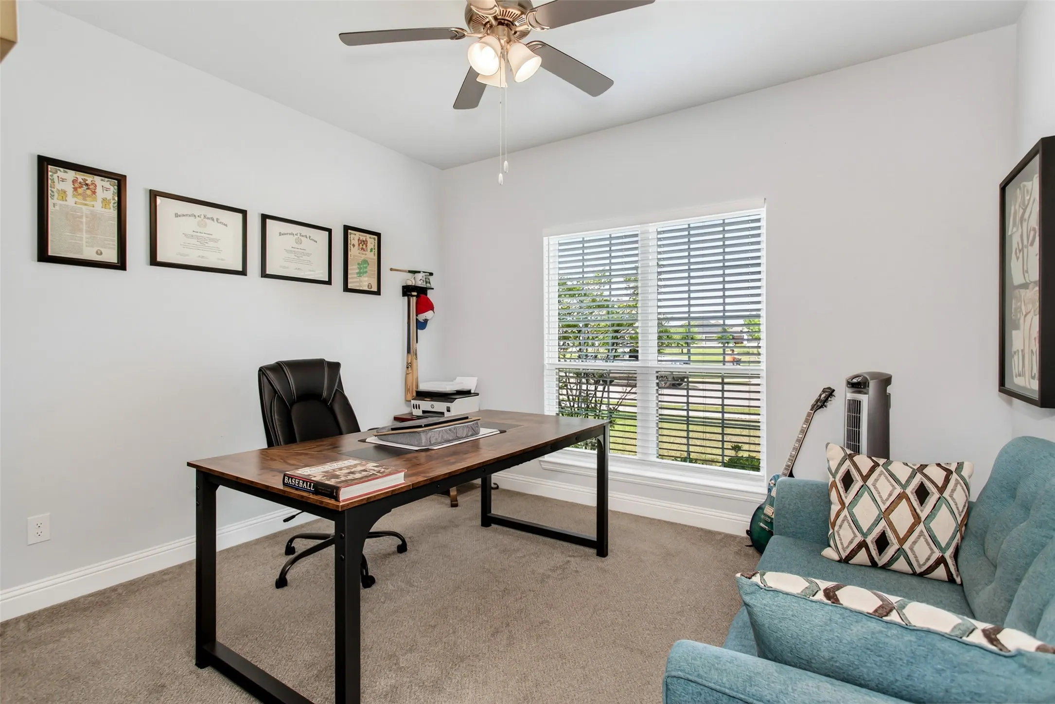 Private front office with large windows, abundant natural light, and flexible space ideal for working from home or a quiet study area.