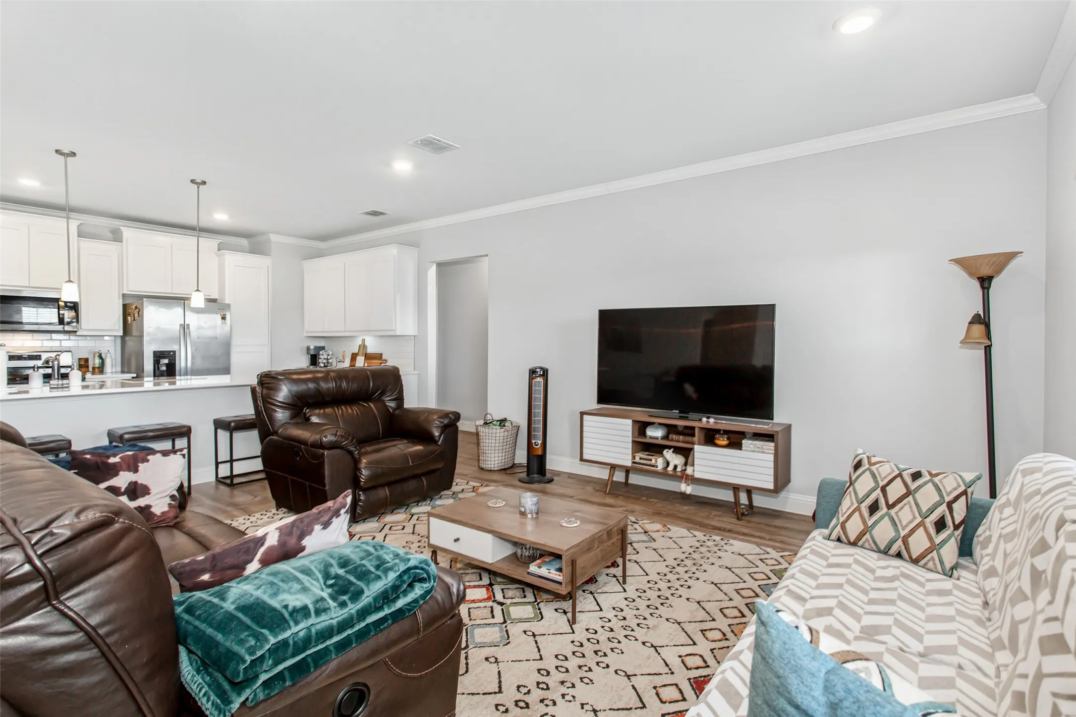 The large family room offers plenty of space for gathering, relaxing, or hosting guests with an open-concept layout and modern finishes throughout.