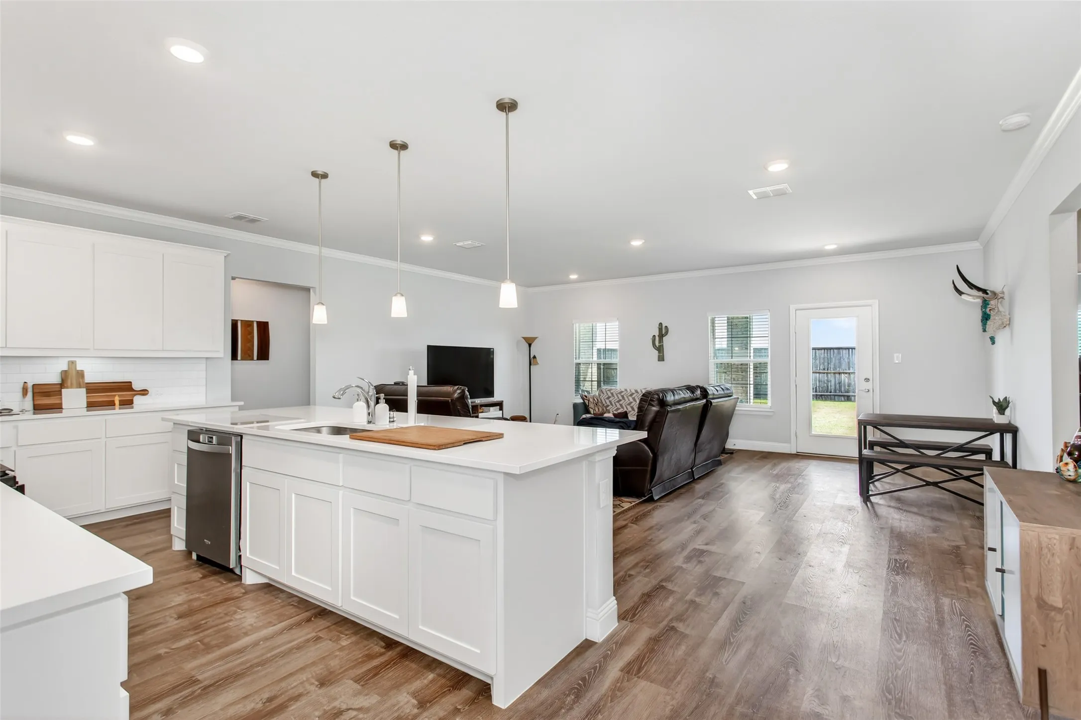 Designed for both everyday living and entertaining, this spacious kitchen opens seamlessly to the living area and offers plenty of prep and gathering space.