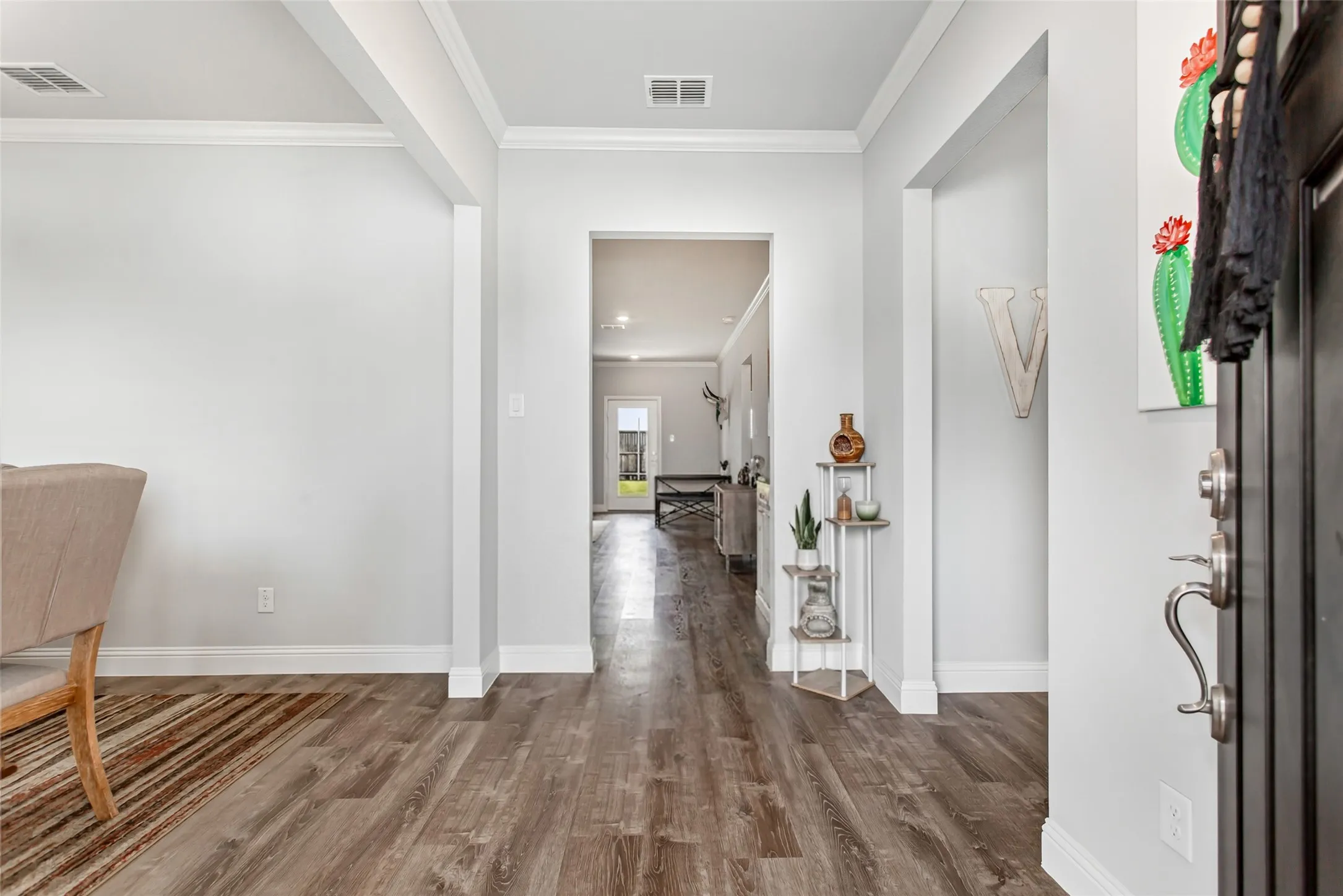 Step inside to an inviting open entry with beautiful flooring, high ceilings, and a light, airy feel throughout.