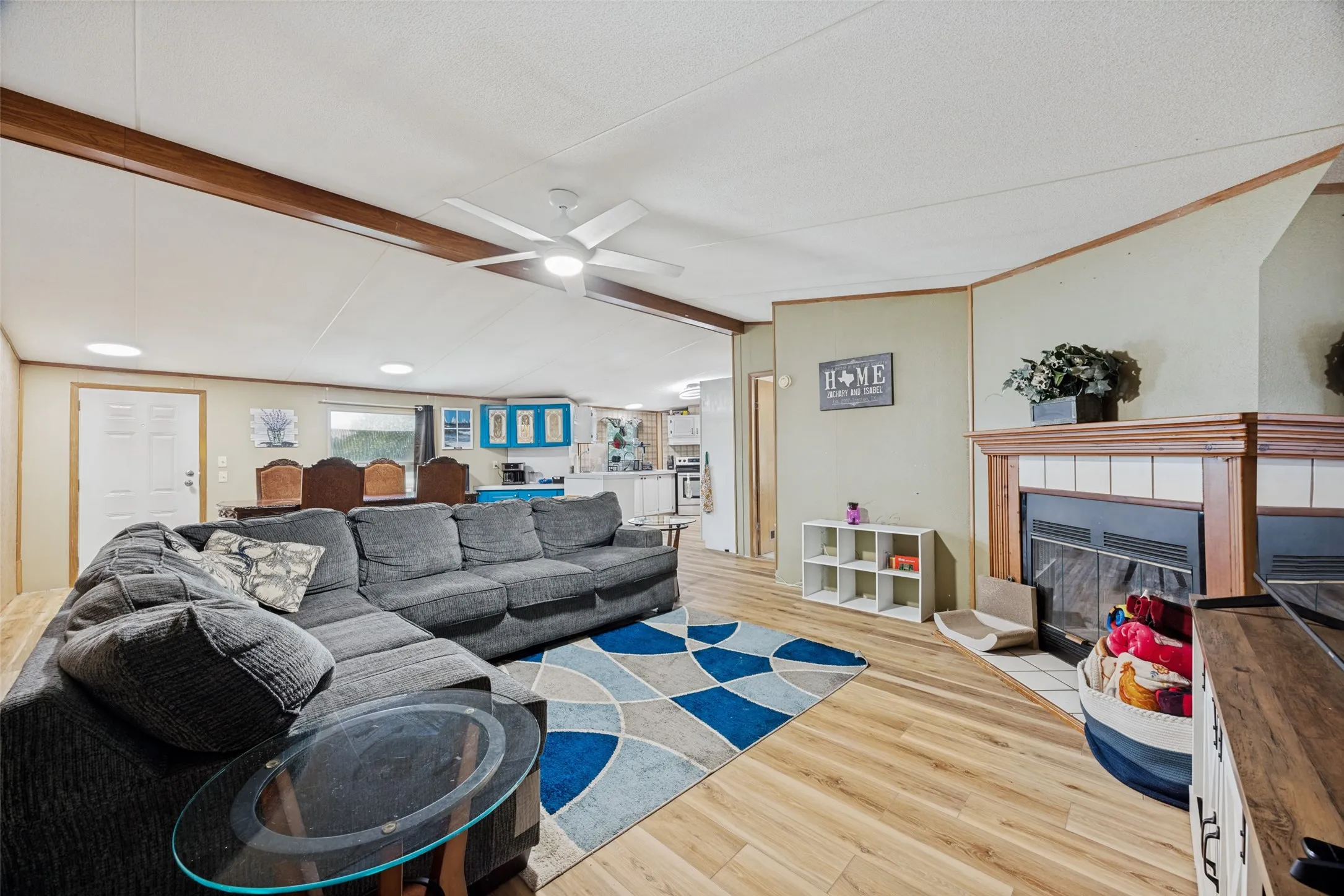 Living area measures 13 x 15 and is anchored by the tile surround, wood burning fireplace.