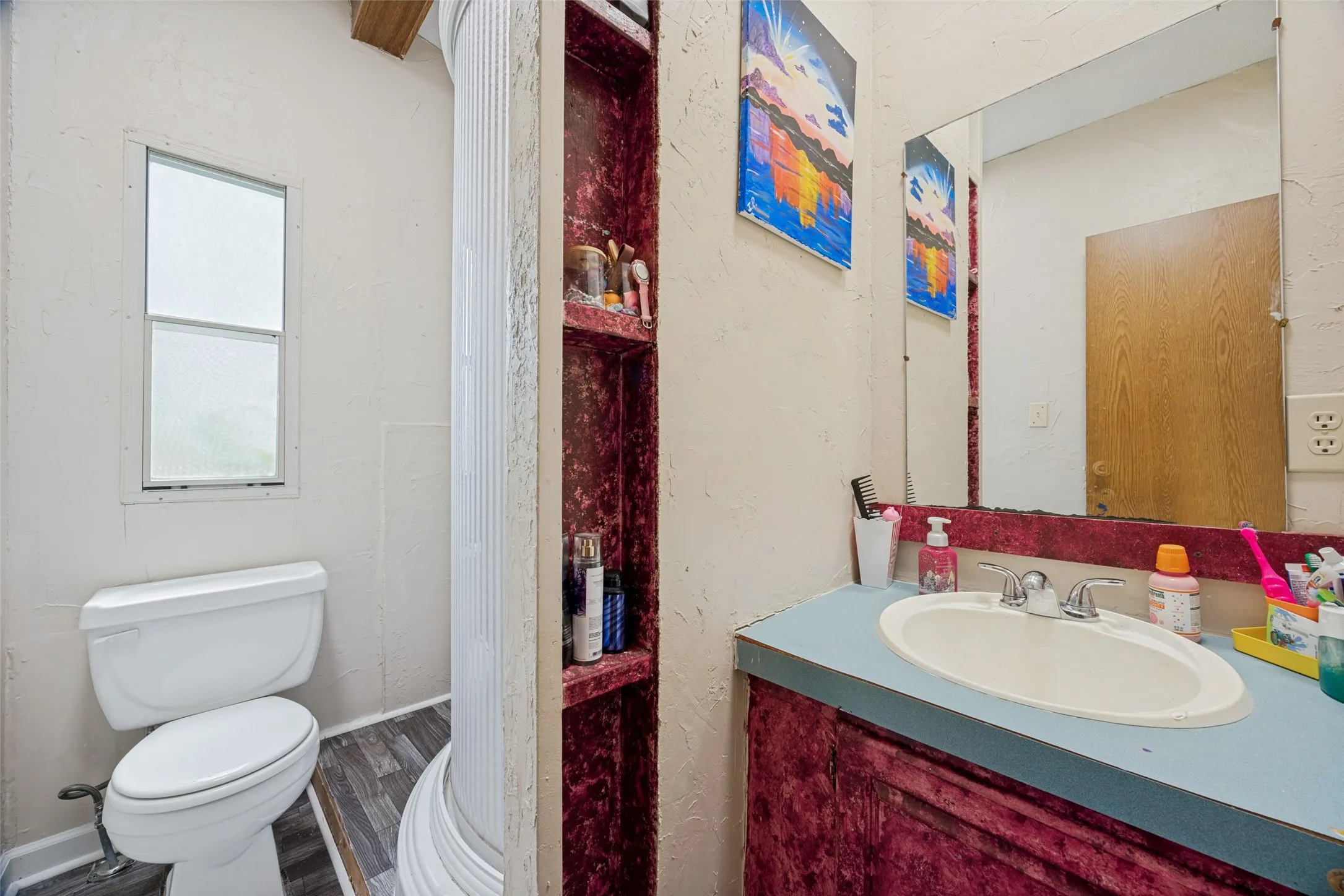 Secondary Main bathroom features an enclosed shower unit, single sink vanity. Future Homeowner may have ideas to completely reconfigure & update this bathroom.