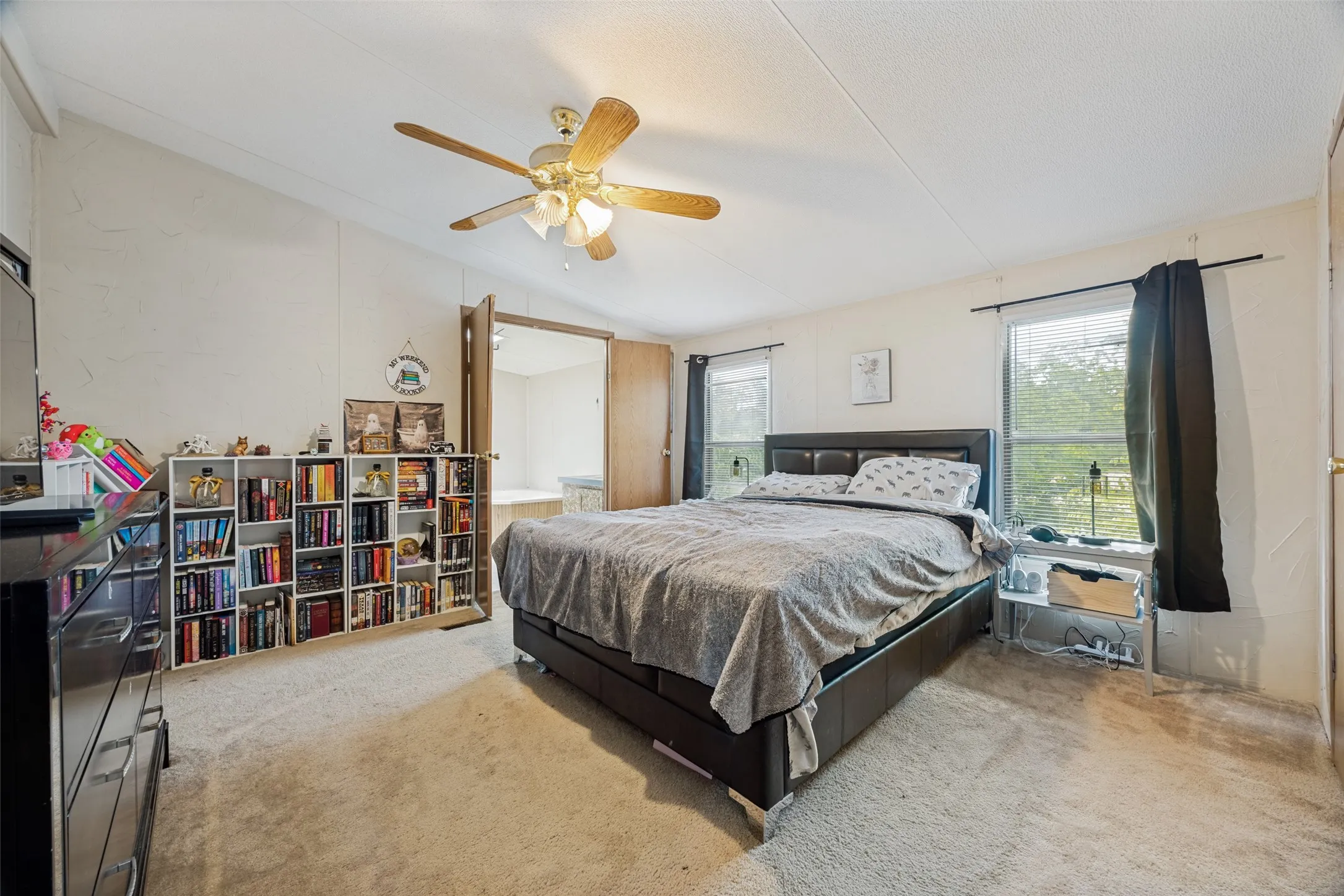 Primary bedroom measures 13x13 with double windows and overlooks the back of the property.