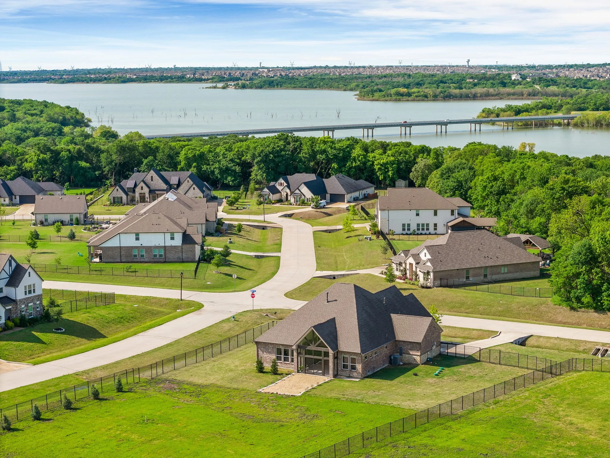Birds eye view of property with a residential view and a water view