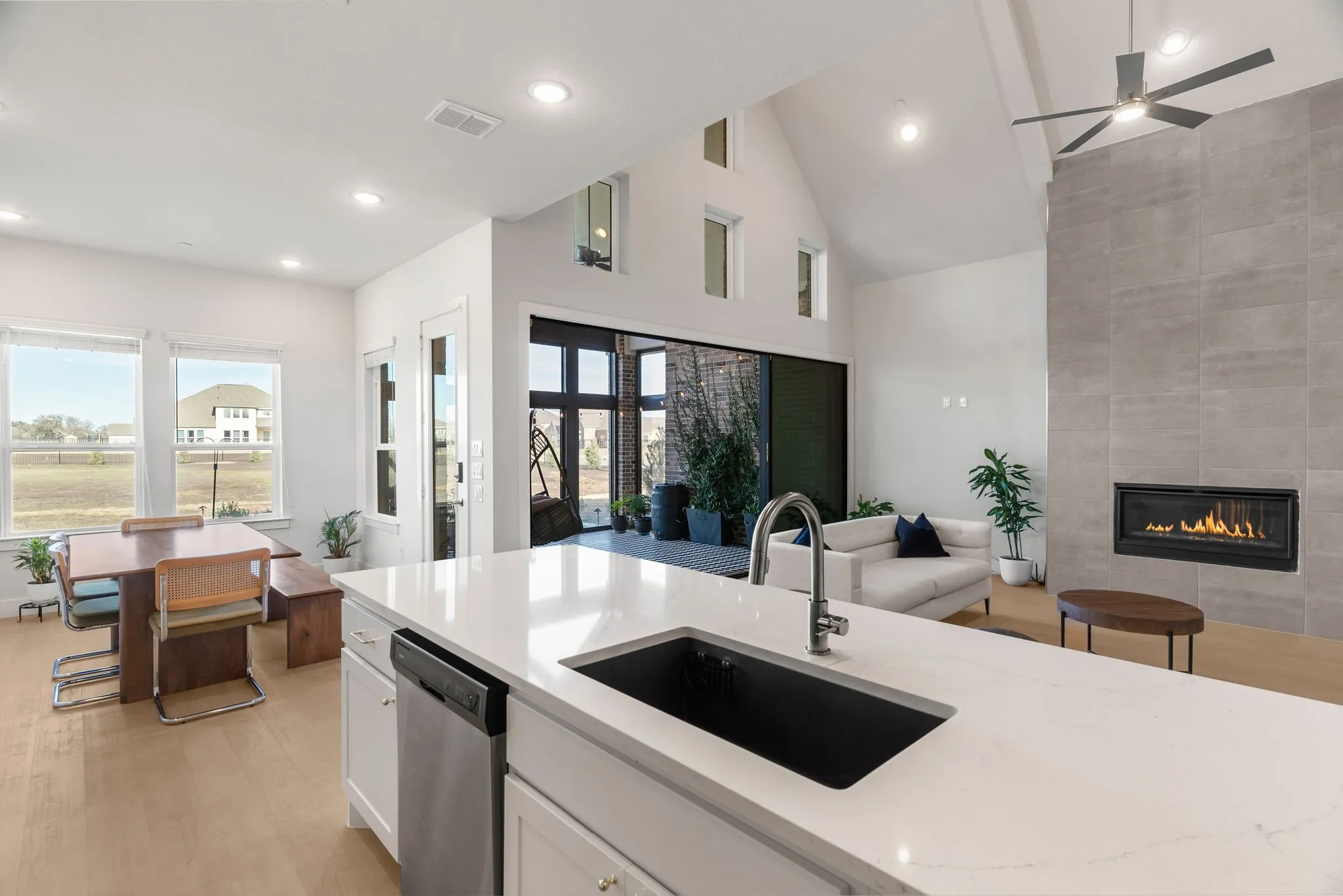 Kitchen with sink, dishwasher, and light hardwood floors