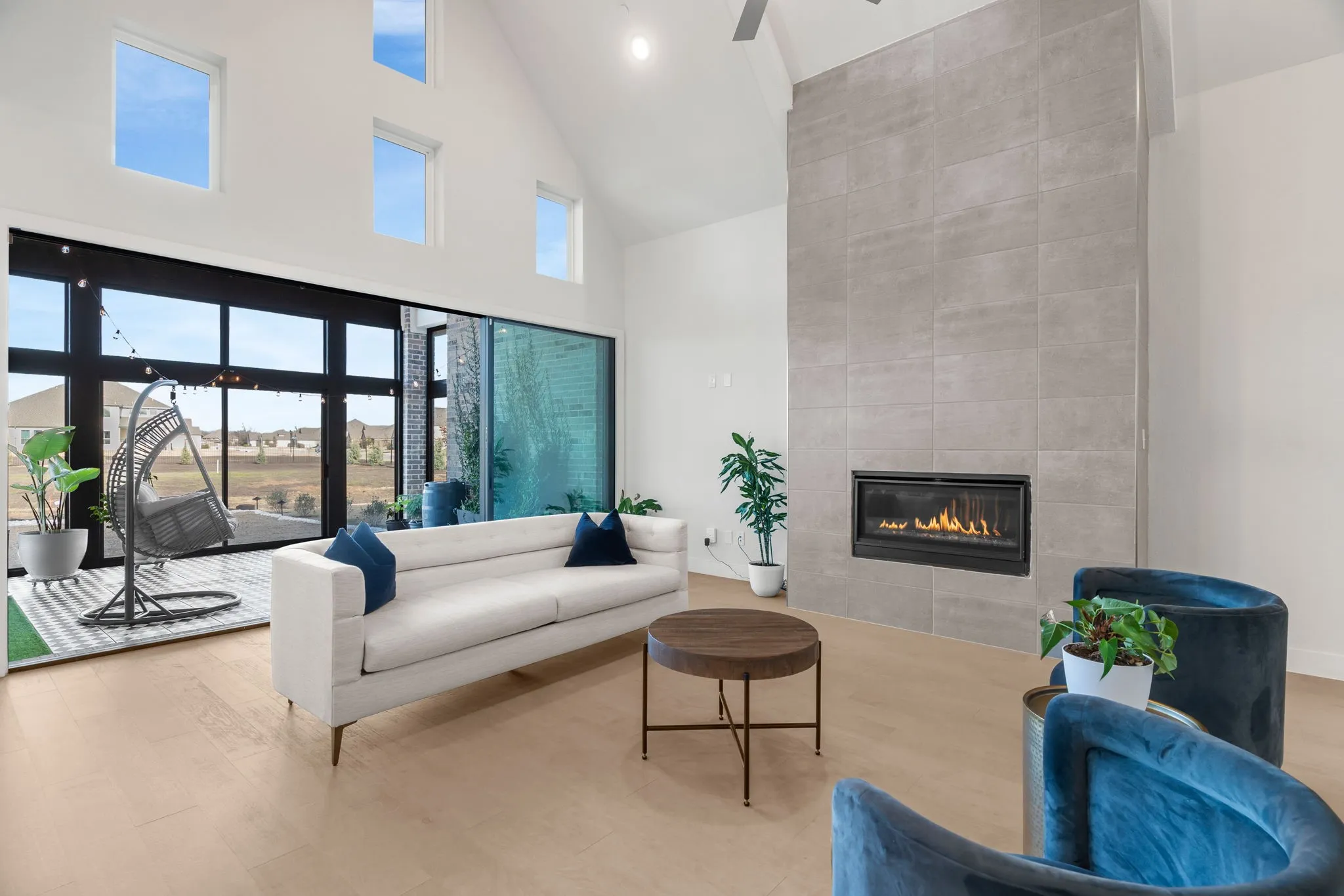 View of living room with sliding doors leading to enclosed patio