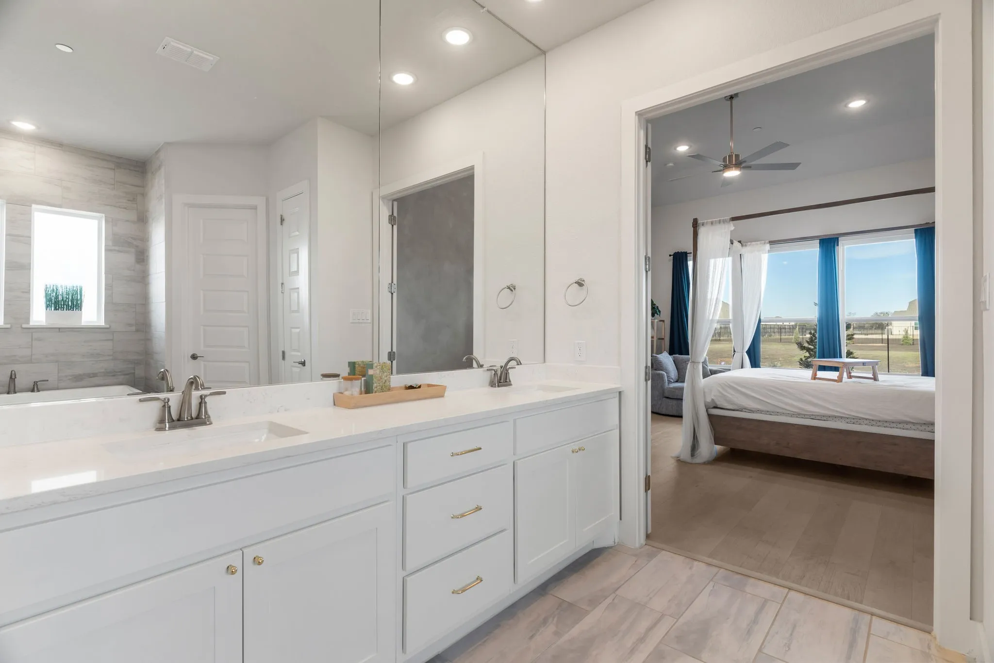 Bathroom with vanity and ceiling fan