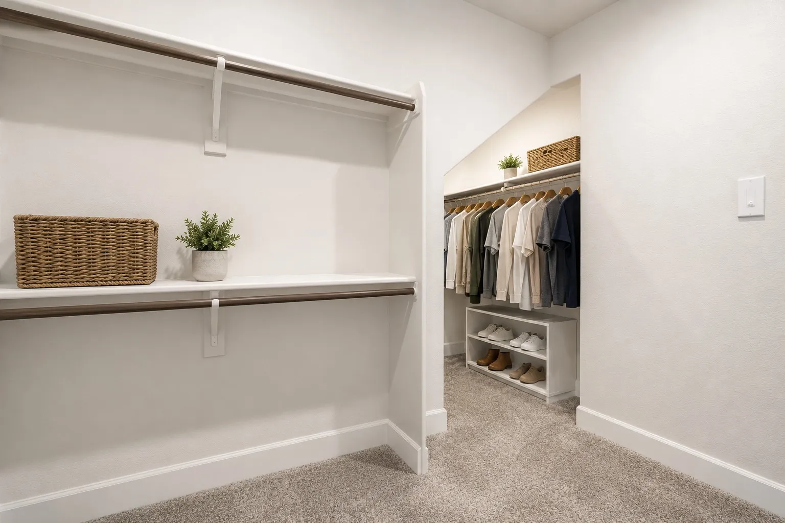 Spacious walk-in closet featuring white walls, light gray carpet, upper and lower shelving, and hanging rods-virtually staged with the clothes