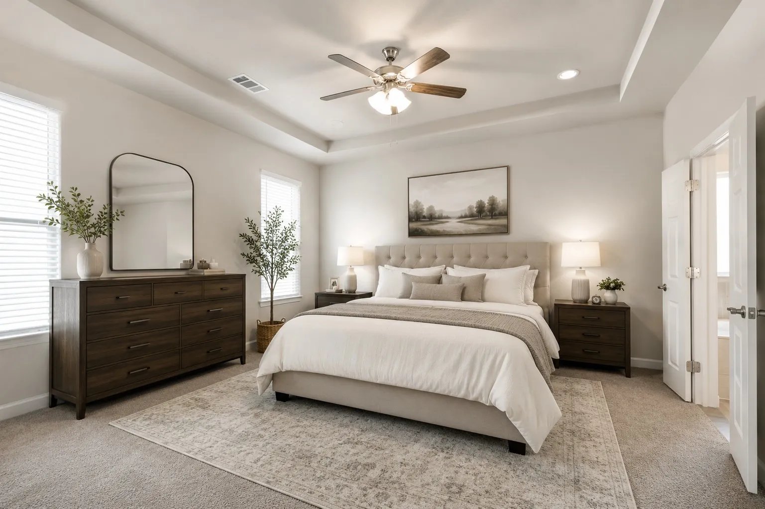 *Virtually Staged* Spacious bedroom featuring a tray ceiling, recessed lighting, and a ceiling fan