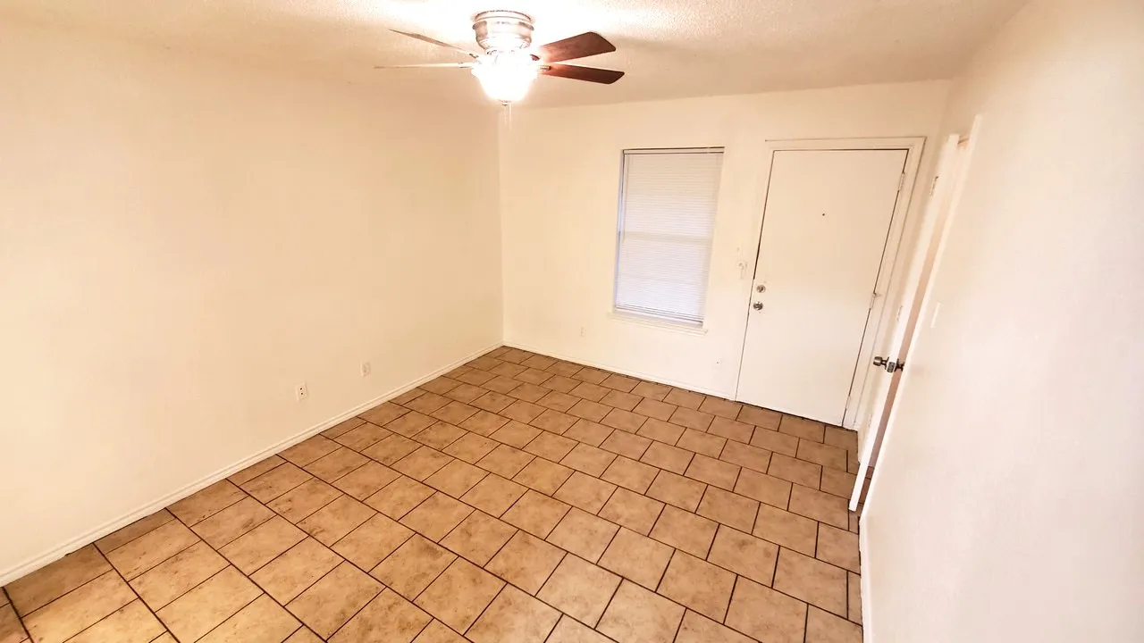 spacious master bedroom has own master bathroom and door towards access to the backyard.
