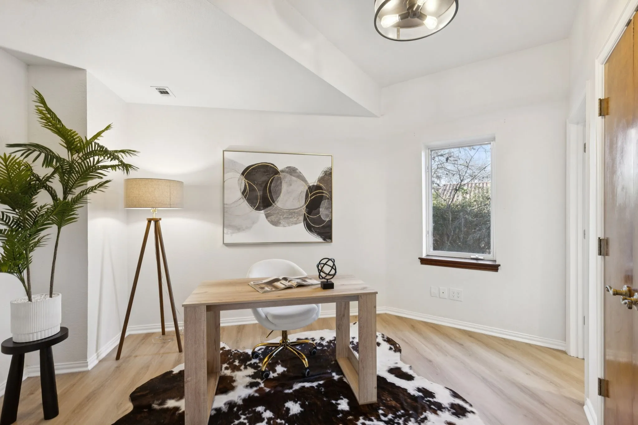 Office area featuring light wood-type flooring and baseboards