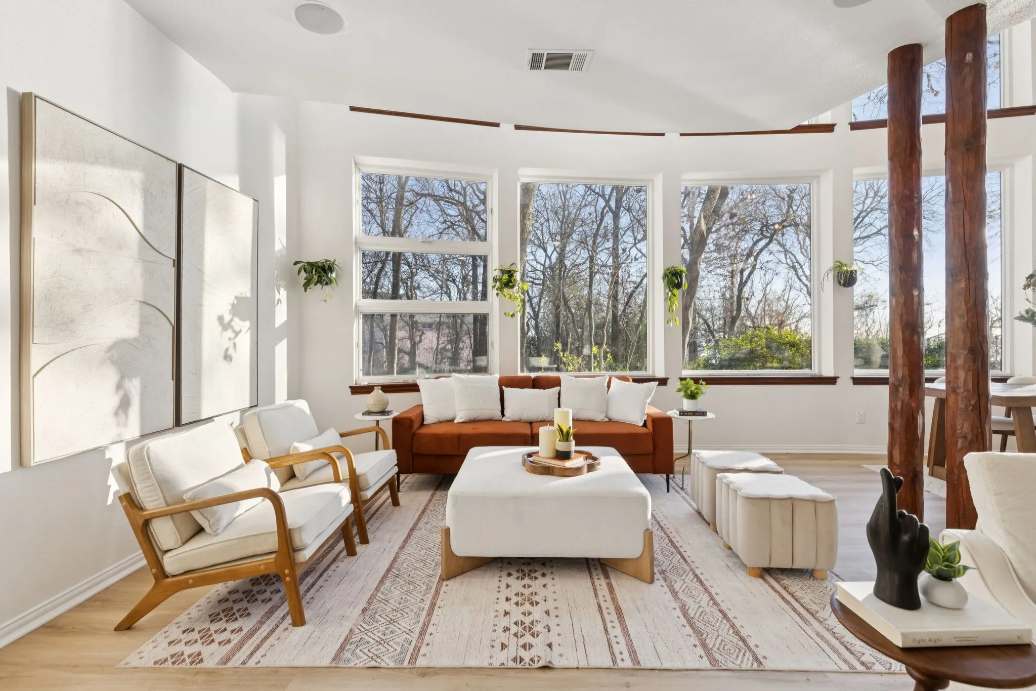 Living area with healthy amount of natural light and wood finished floors