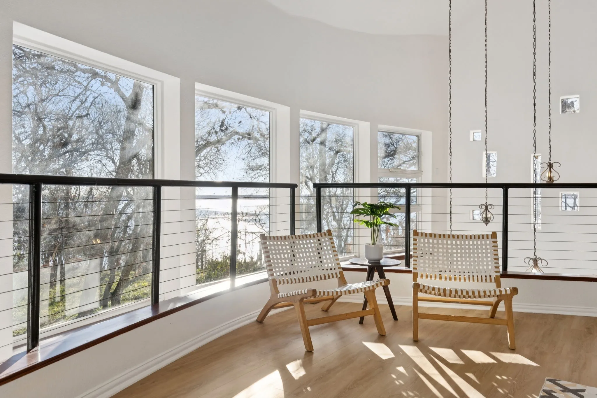 Balcony featuring a sunroom