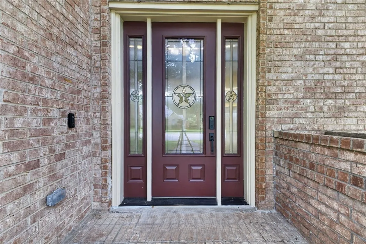 Welcoming entry with updated front door.