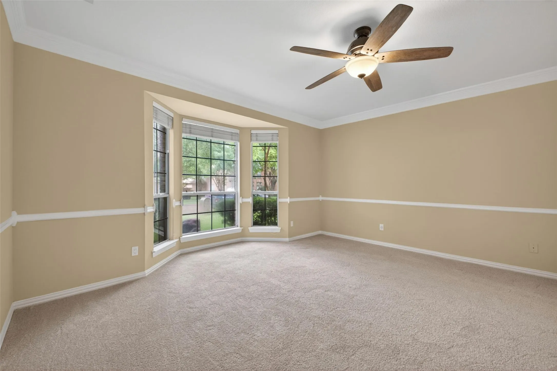 Spacious primary bedroom retreat with comfortable proportions and updated flooring.