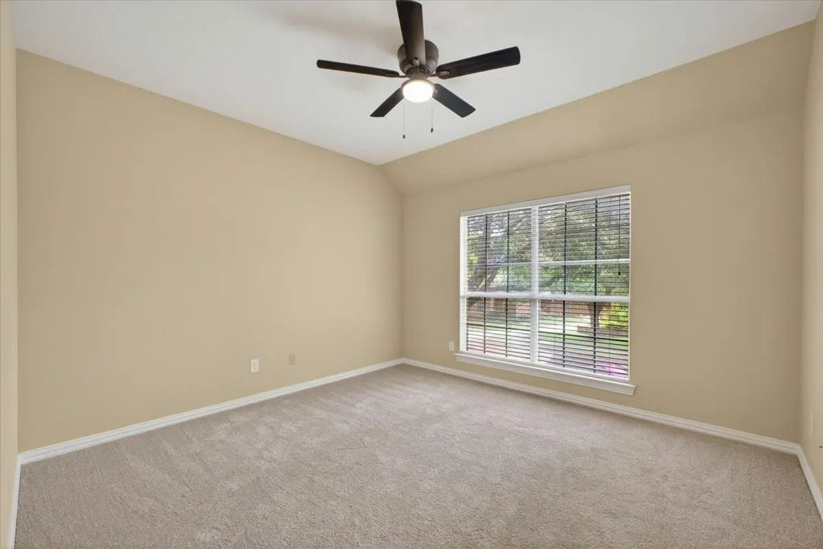 four of six bedrooms providing flexible space for family, guests, or a home office.