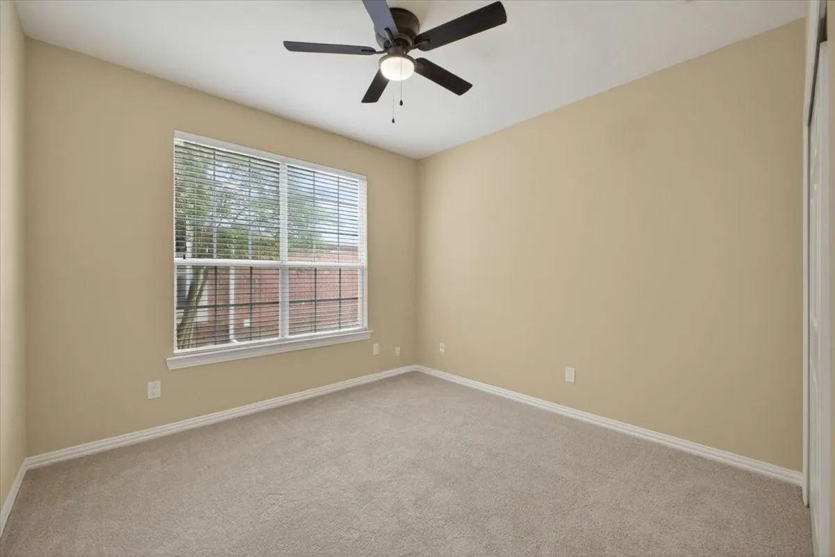one of six bedrooms providing flexible space for family, guests.