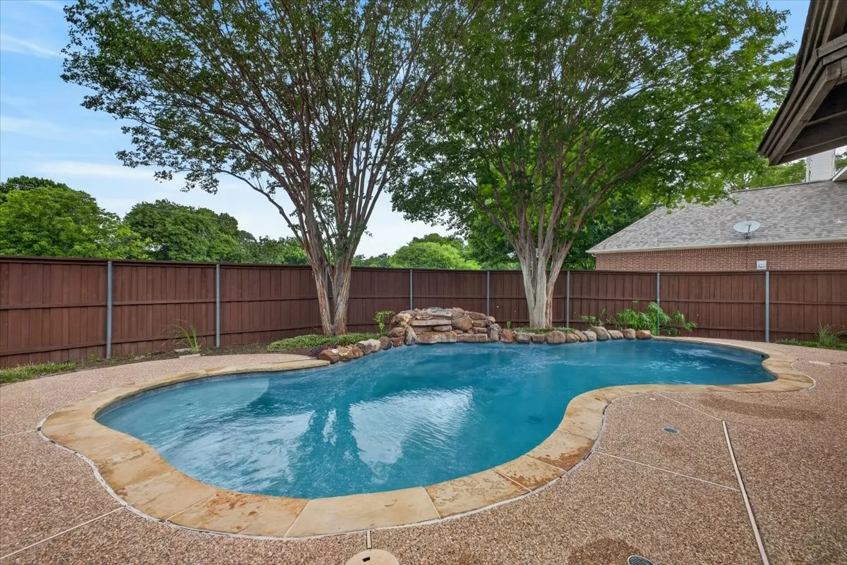Pool and fenced backyard.