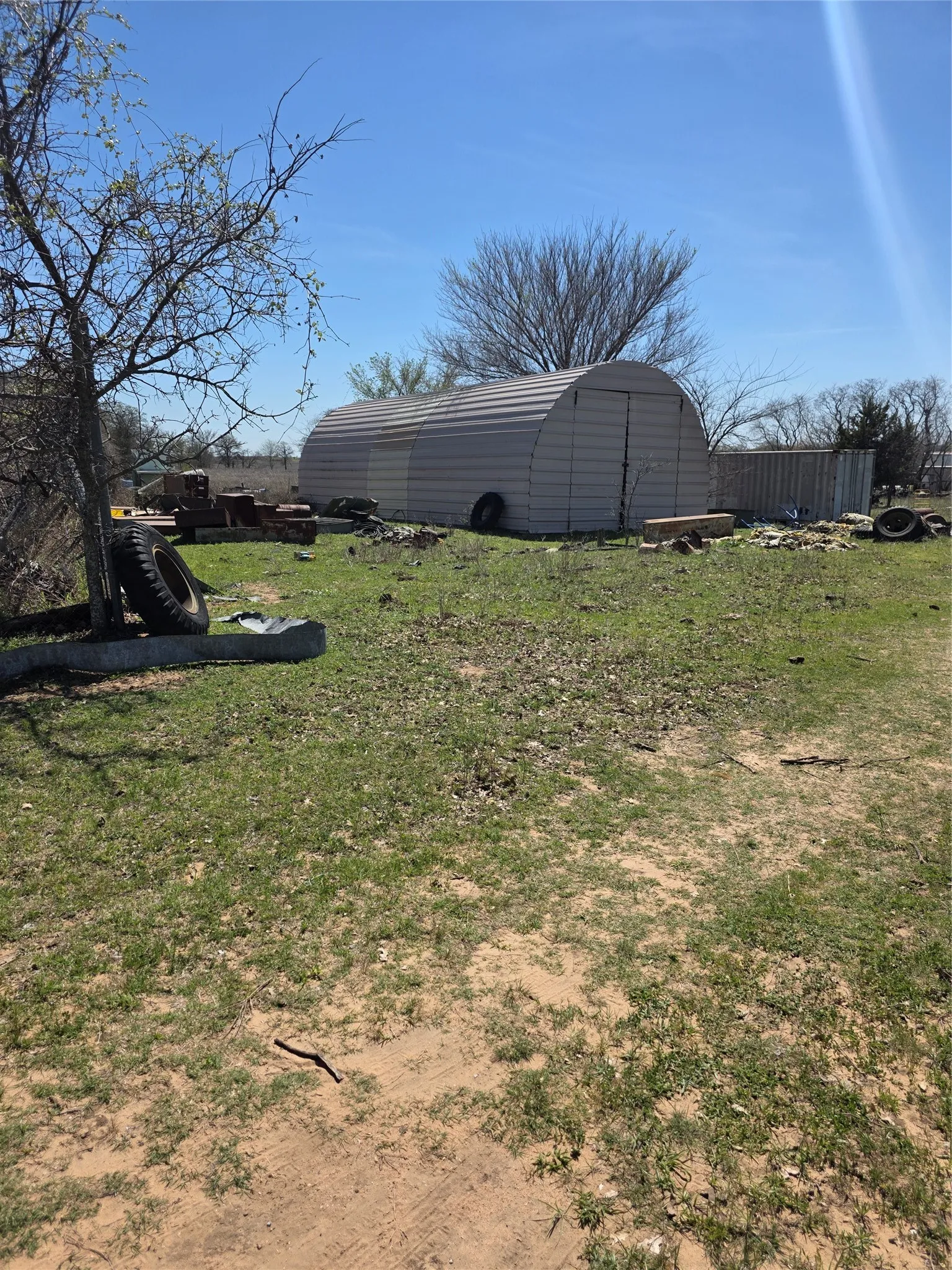 Third building is outside fenced area and has gravel base