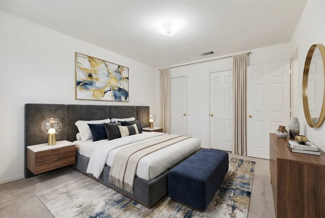 Bedroom featuring light-colored walls and carpet flooring