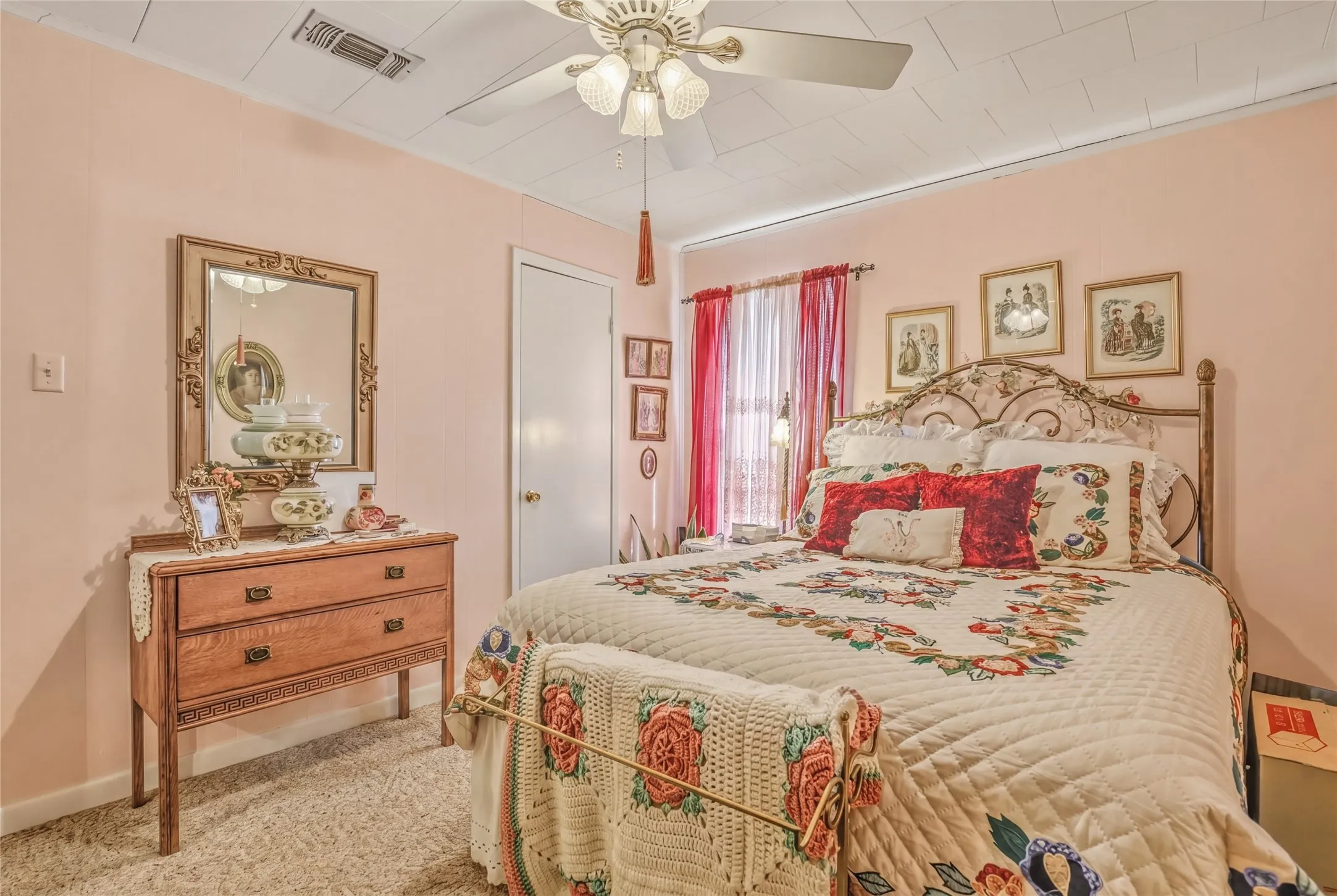Bedroom featuring light pink walls and a textured ceiling