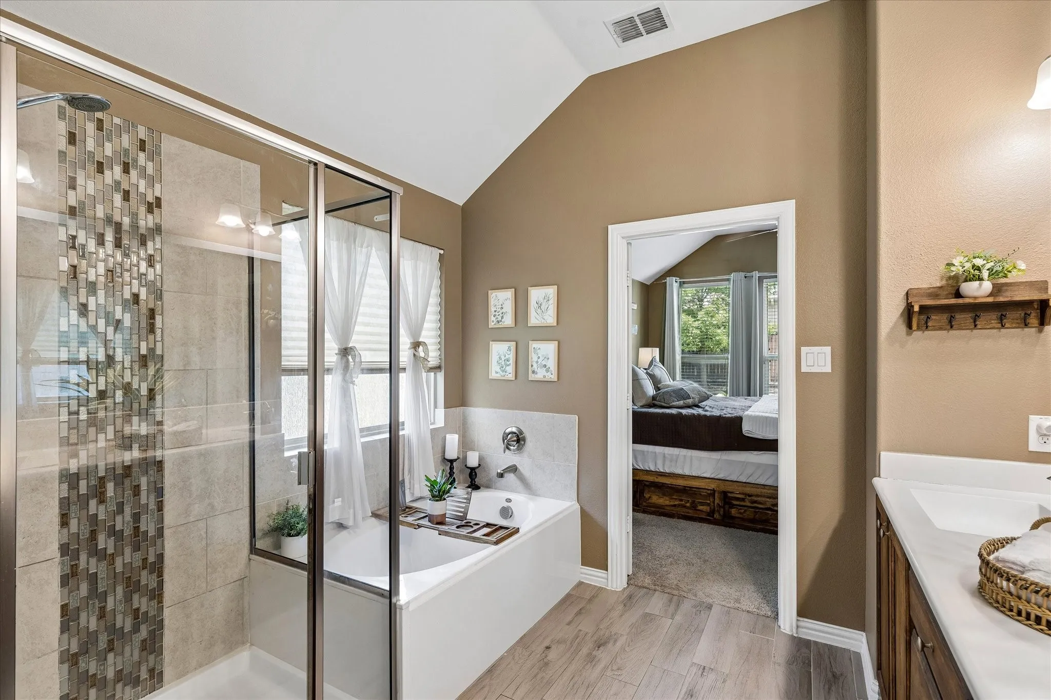 Primary bathroom with a relaxing soak tub and a tiled walk in shower.