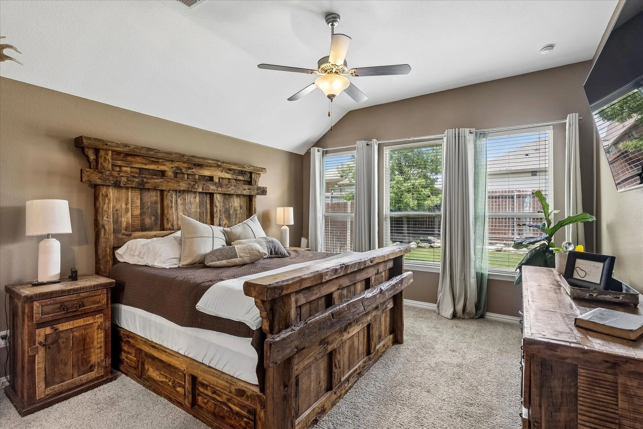 Large primary bedroom with great natural lighting.