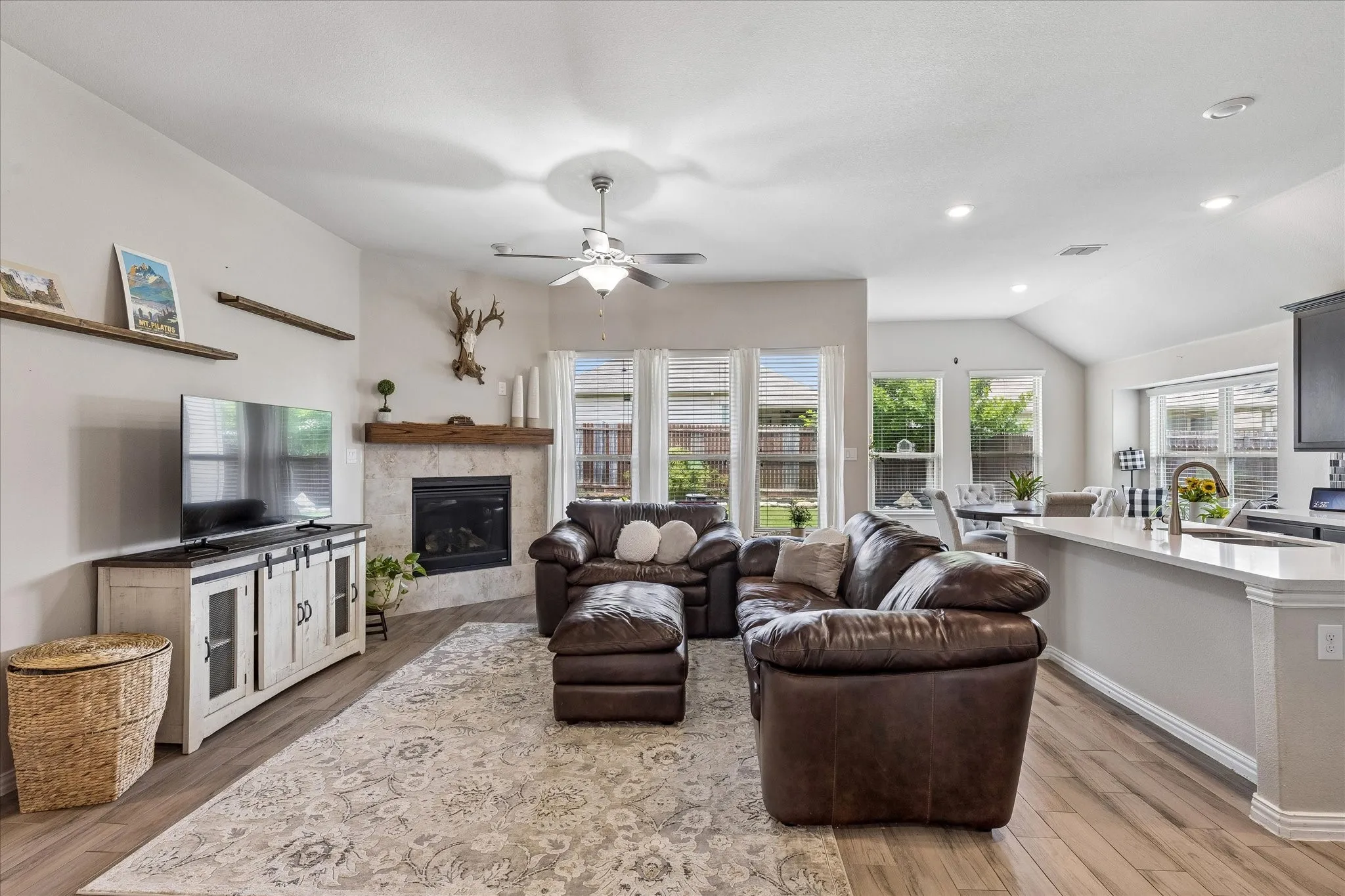 Open Living area with raised ceilings and recessed lighting.