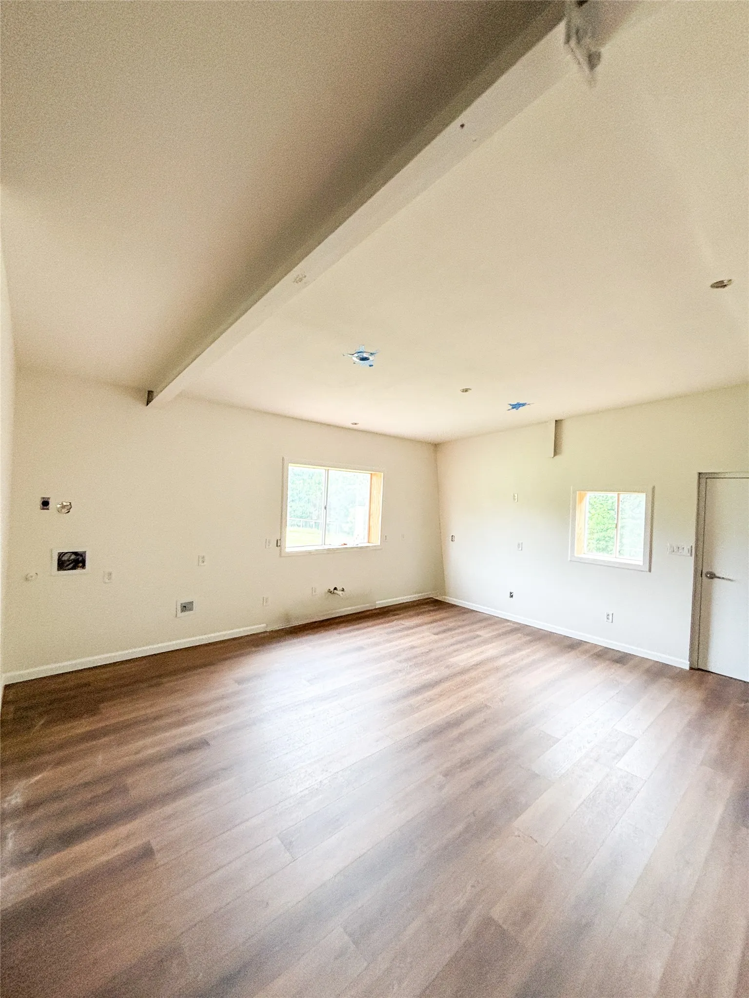 This kitchen area has been set up to have stackable laundry as well.