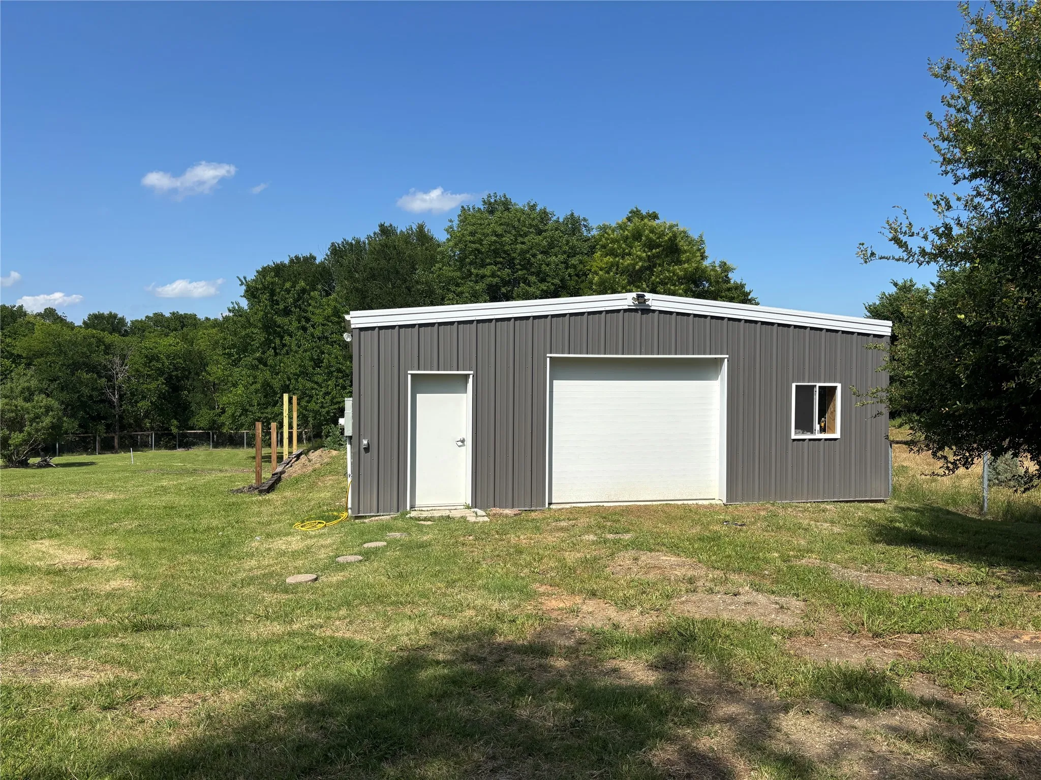 Front of ADU
Has two sections divided by french doors. One section was designed to be a suite with a full bathroom, hook ups for a full kitchen plus laundry room. The other section was designed to be an office, gym, or 2nd bedroom. Deck will be built off of suite before closing.