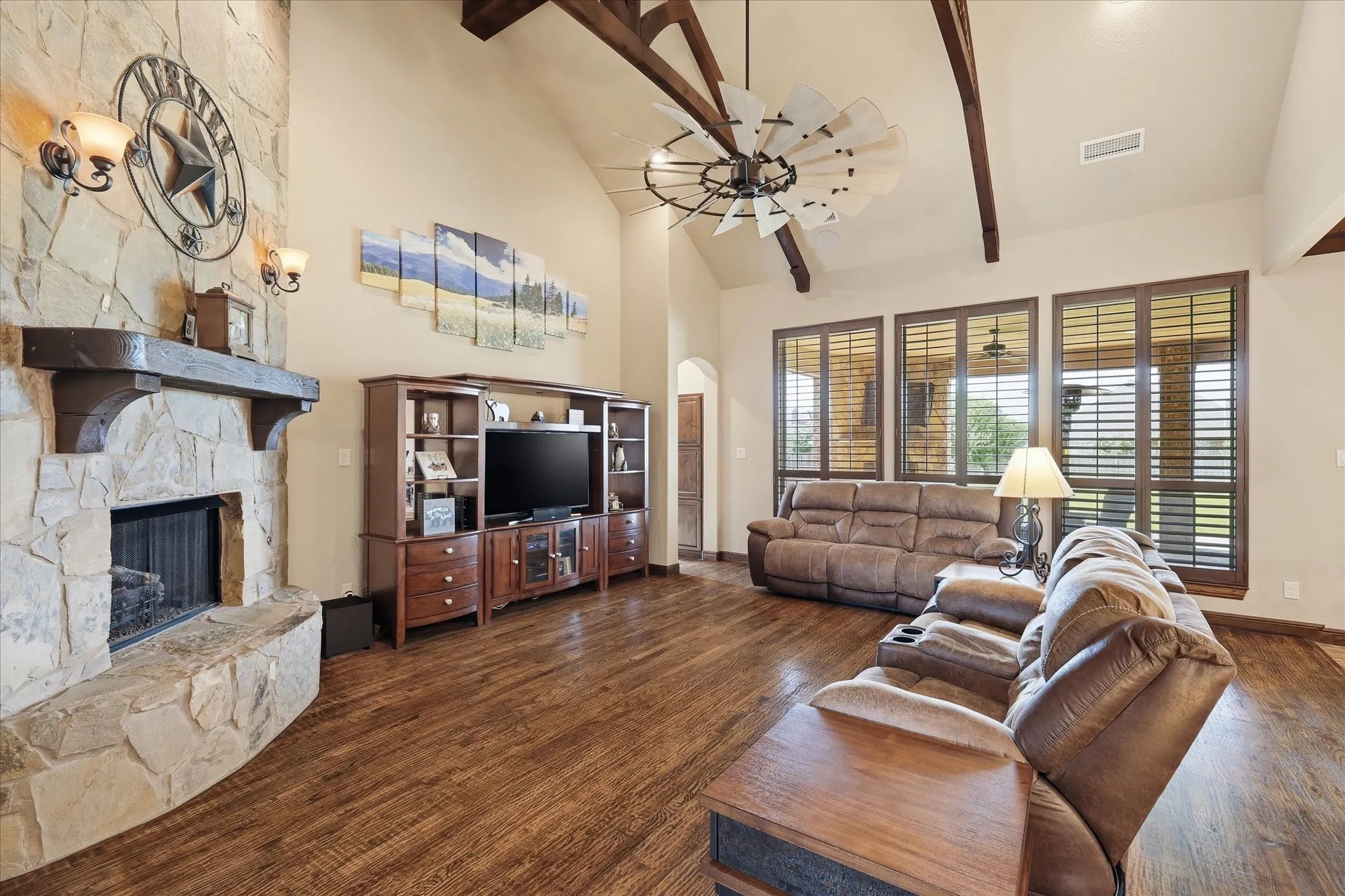 Vaulted ceilings with exposed wood beams in this spacious room