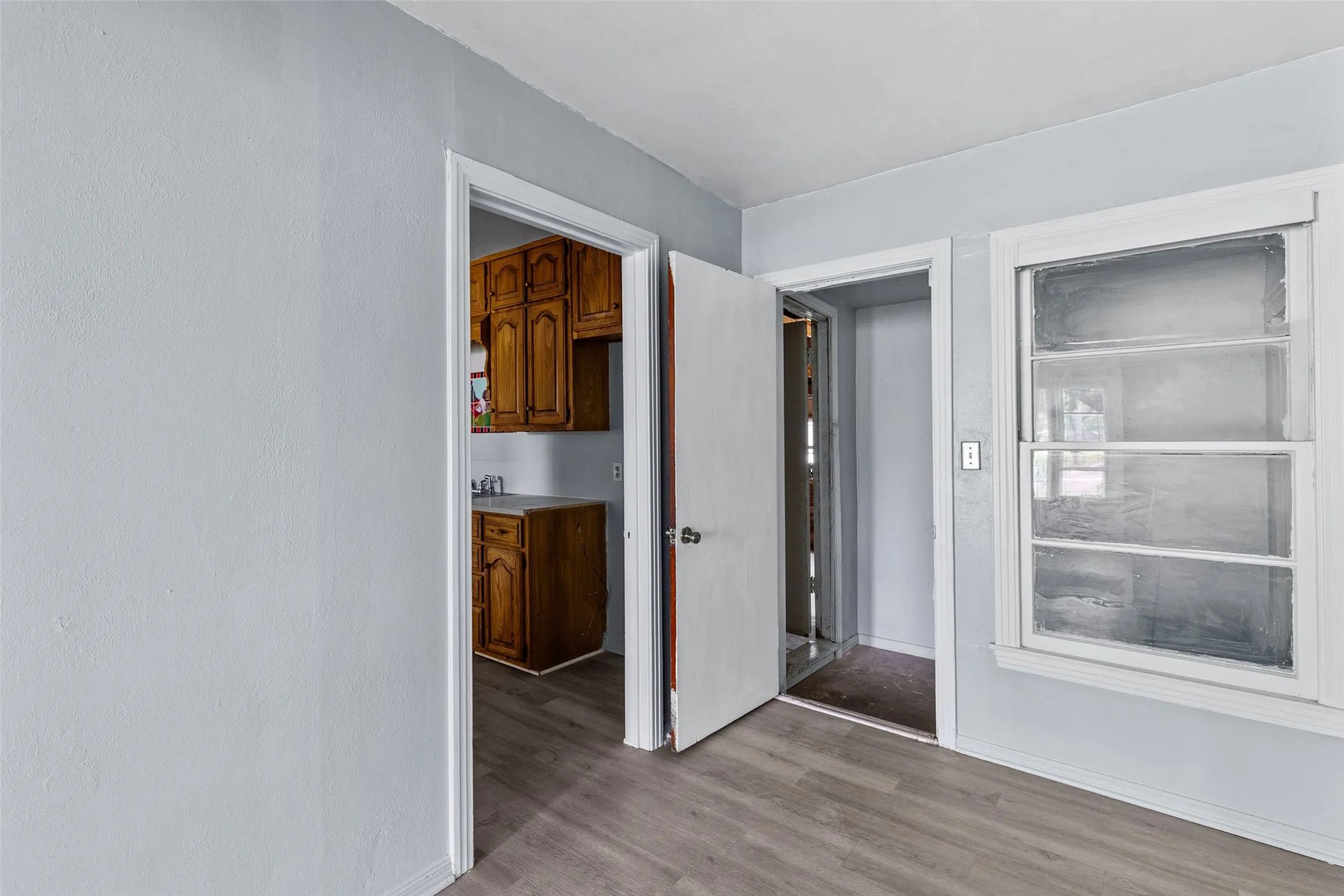 Transition from dining into framed - unfinished area of house.