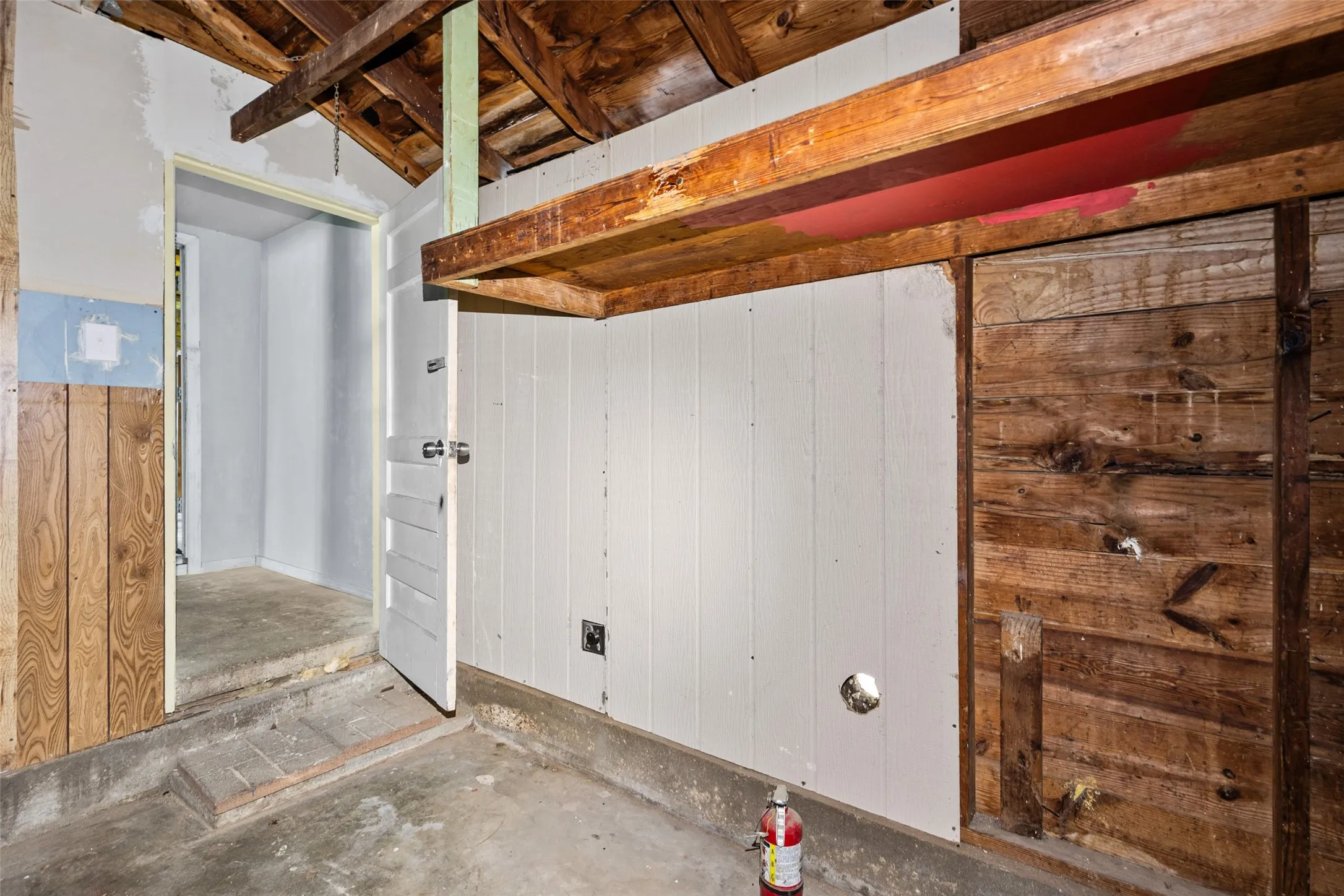 Transition from living quarters to framed unfinished rooms.