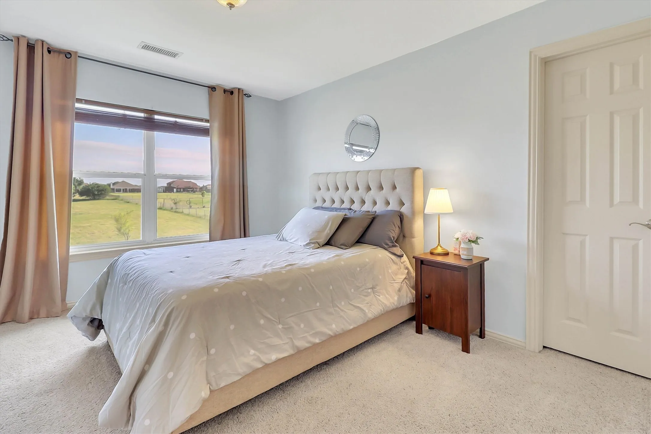 Expansive window framing a water and landscape panorama