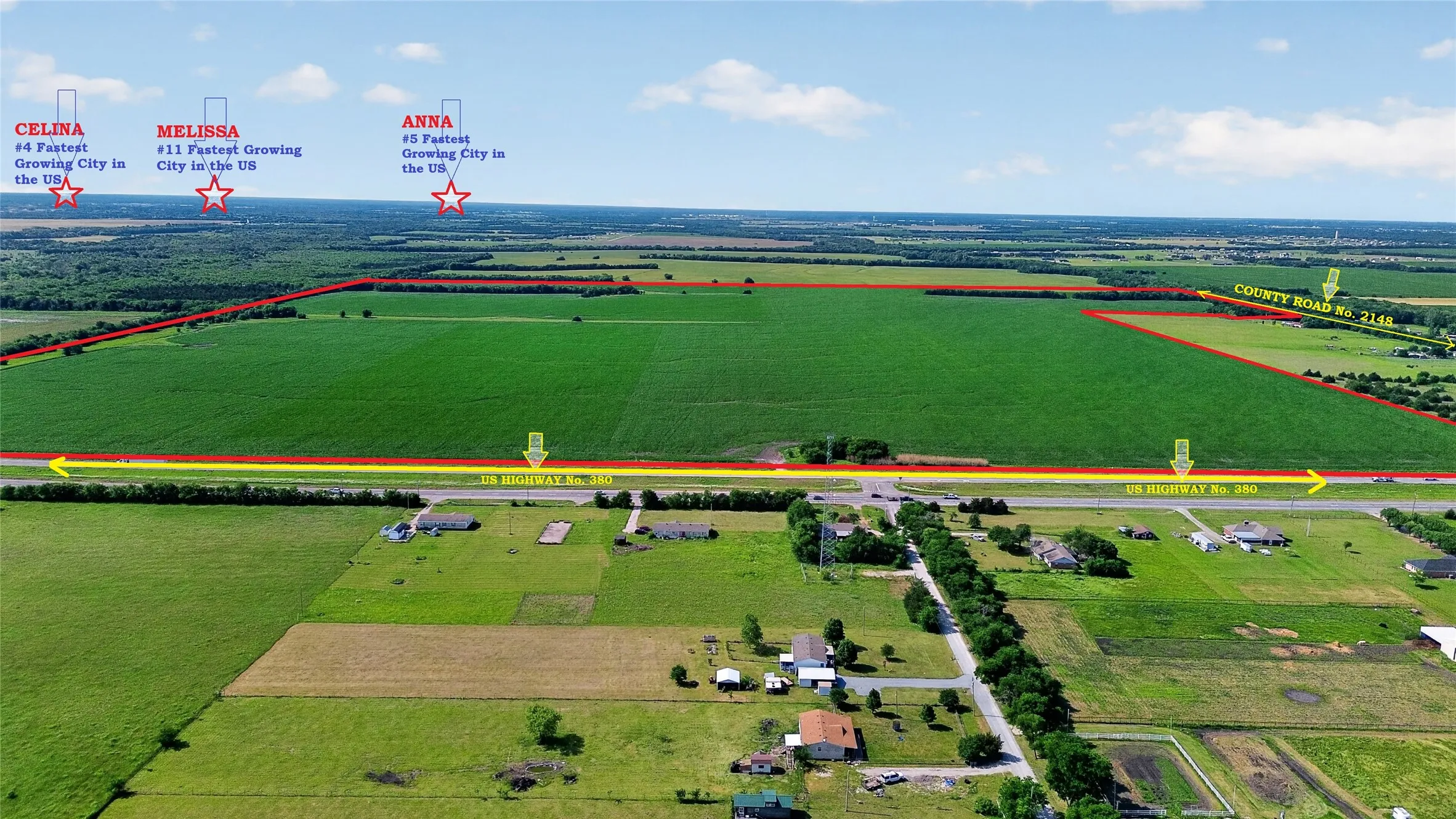 Expansive agricultural land featuring a verdant crop field and clear blue skies