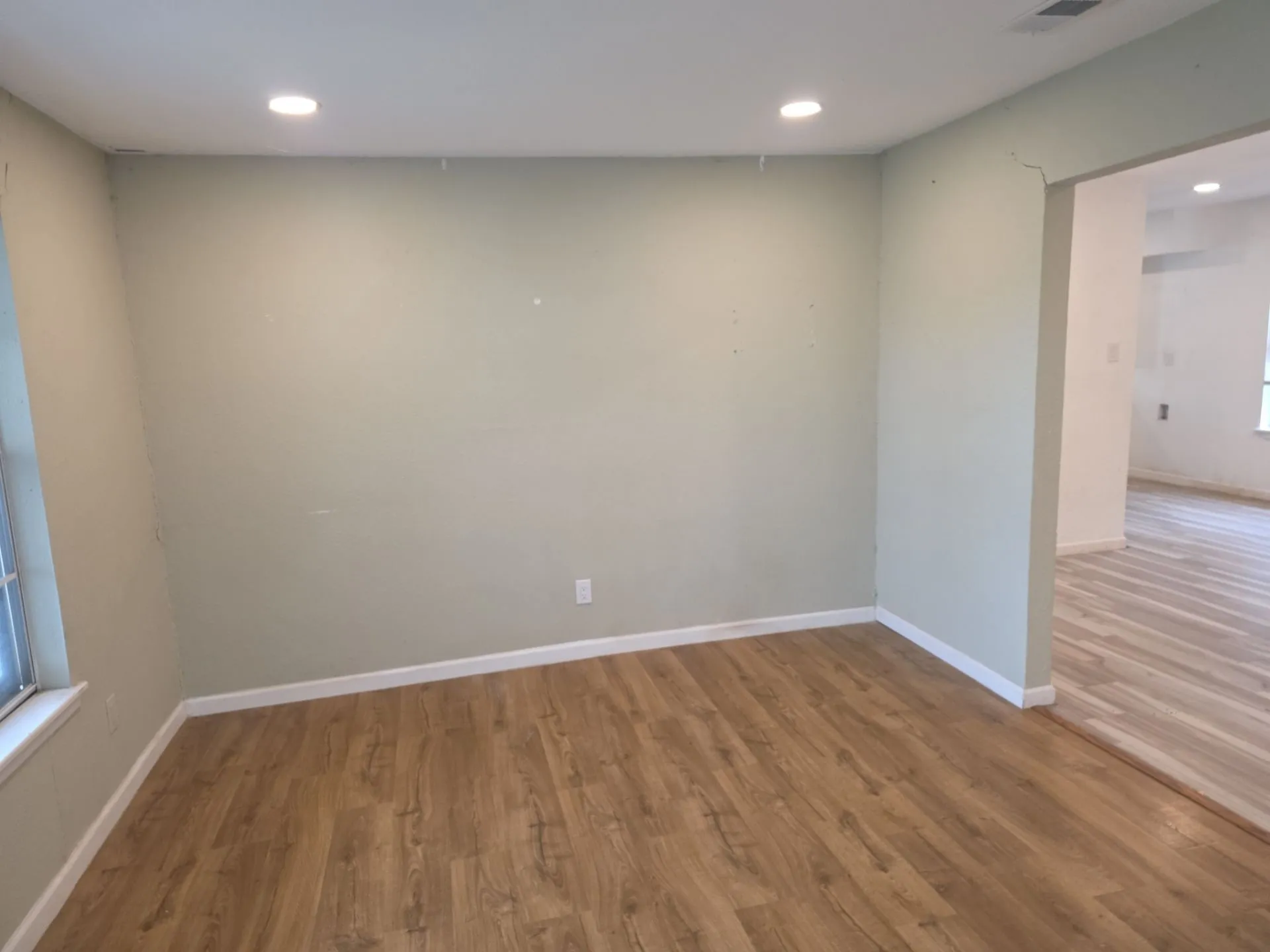 Interior room featuring wood-finish flooring and recessed ceiling lighting