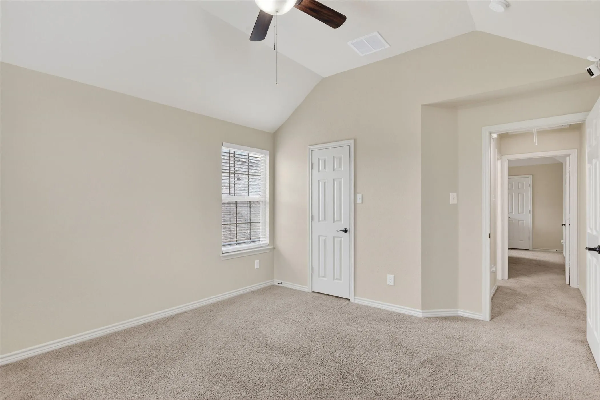 Bedroom 5 upstairs featuring a vaulted ceiling with a ceiling fan, a window with horizontal blinds, and a paneled door