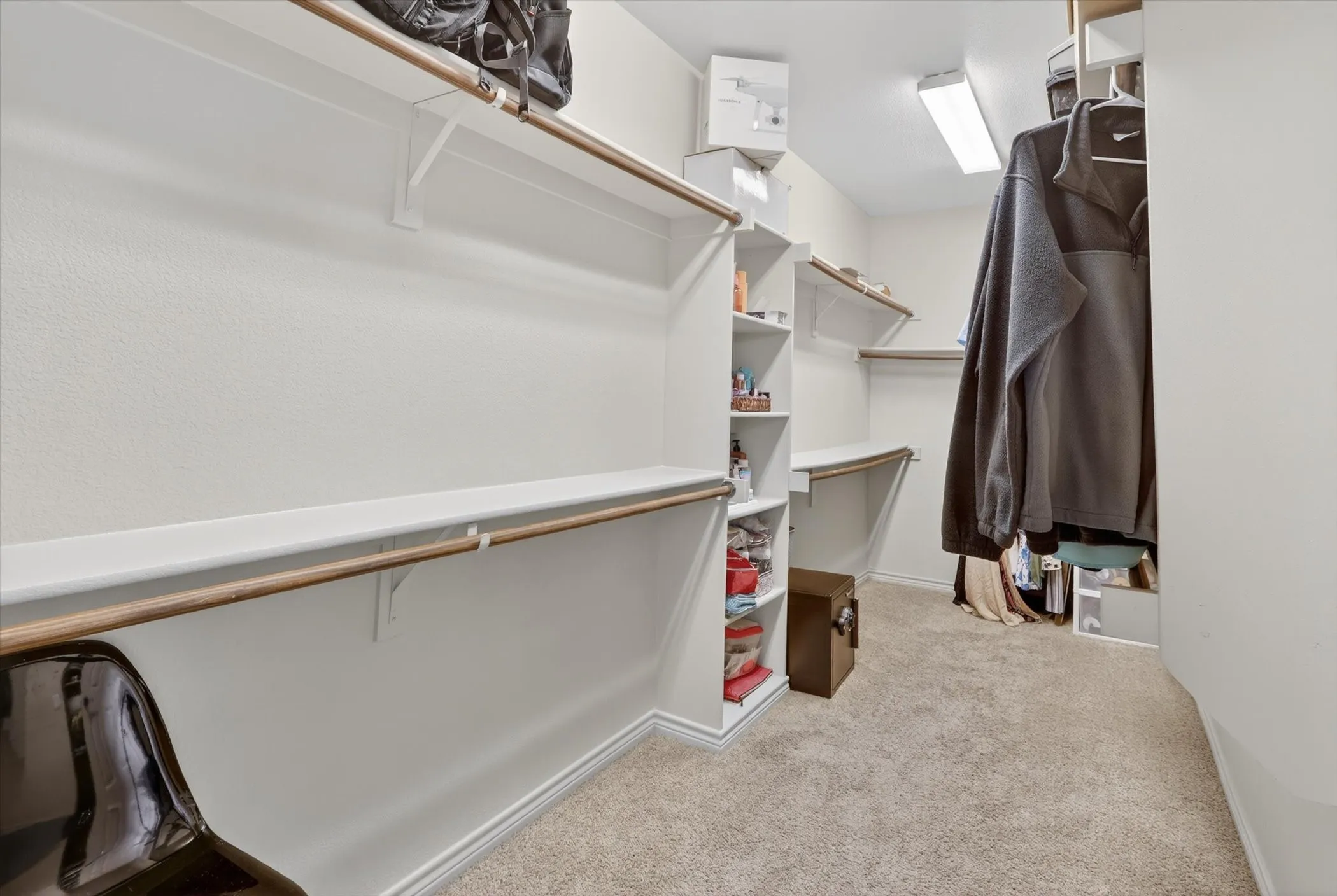 Walk-in closet in primary bedroom