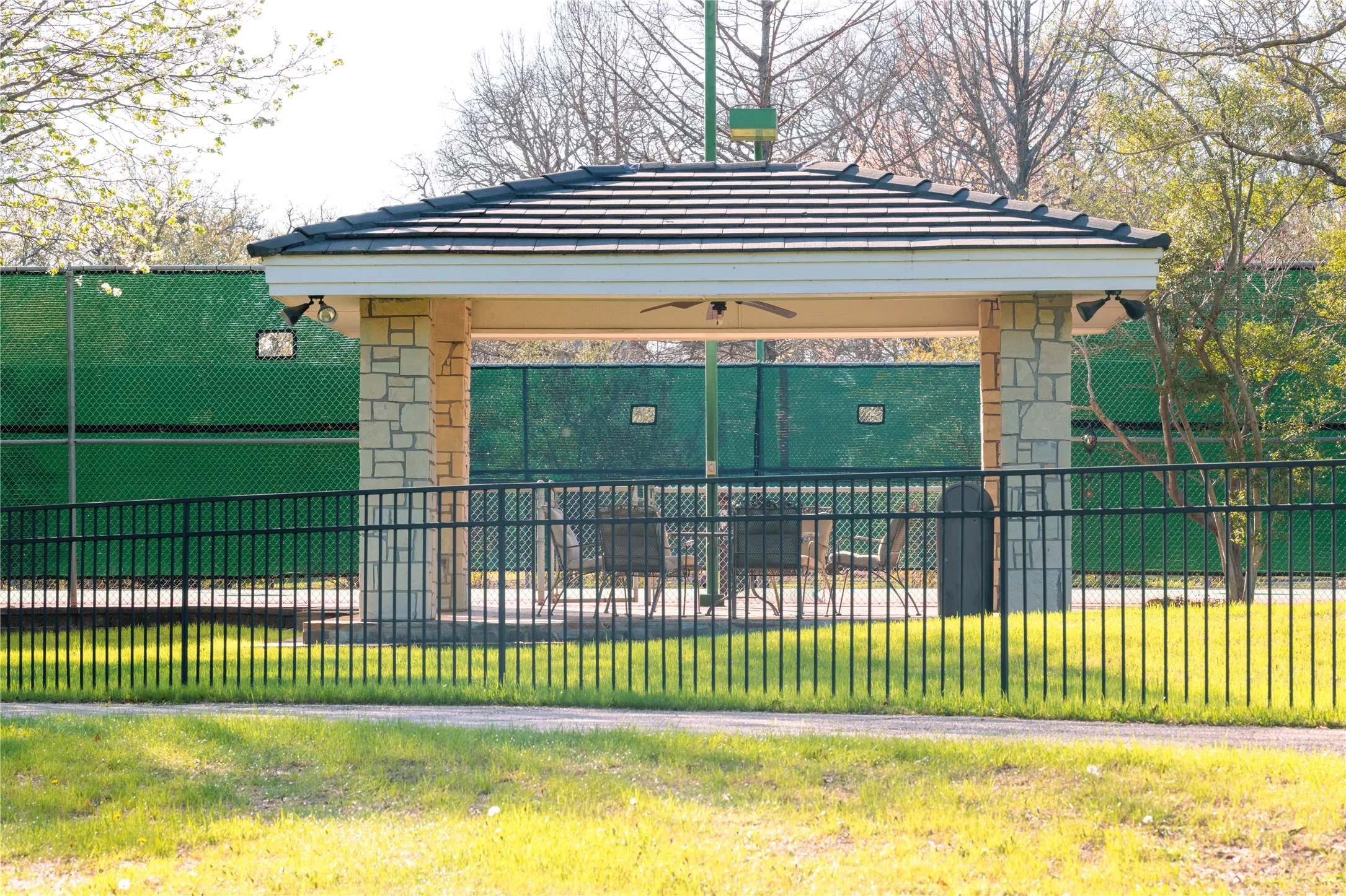 Tennis court with covered pavilion.