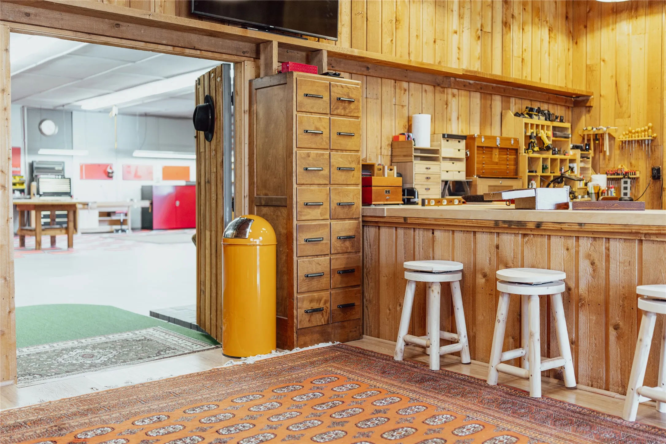 Workshop includes a rustic wood paneled Hobby Room.