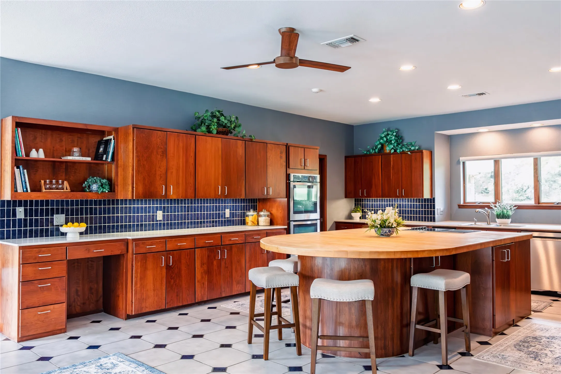 Kitchen with butcher block island.